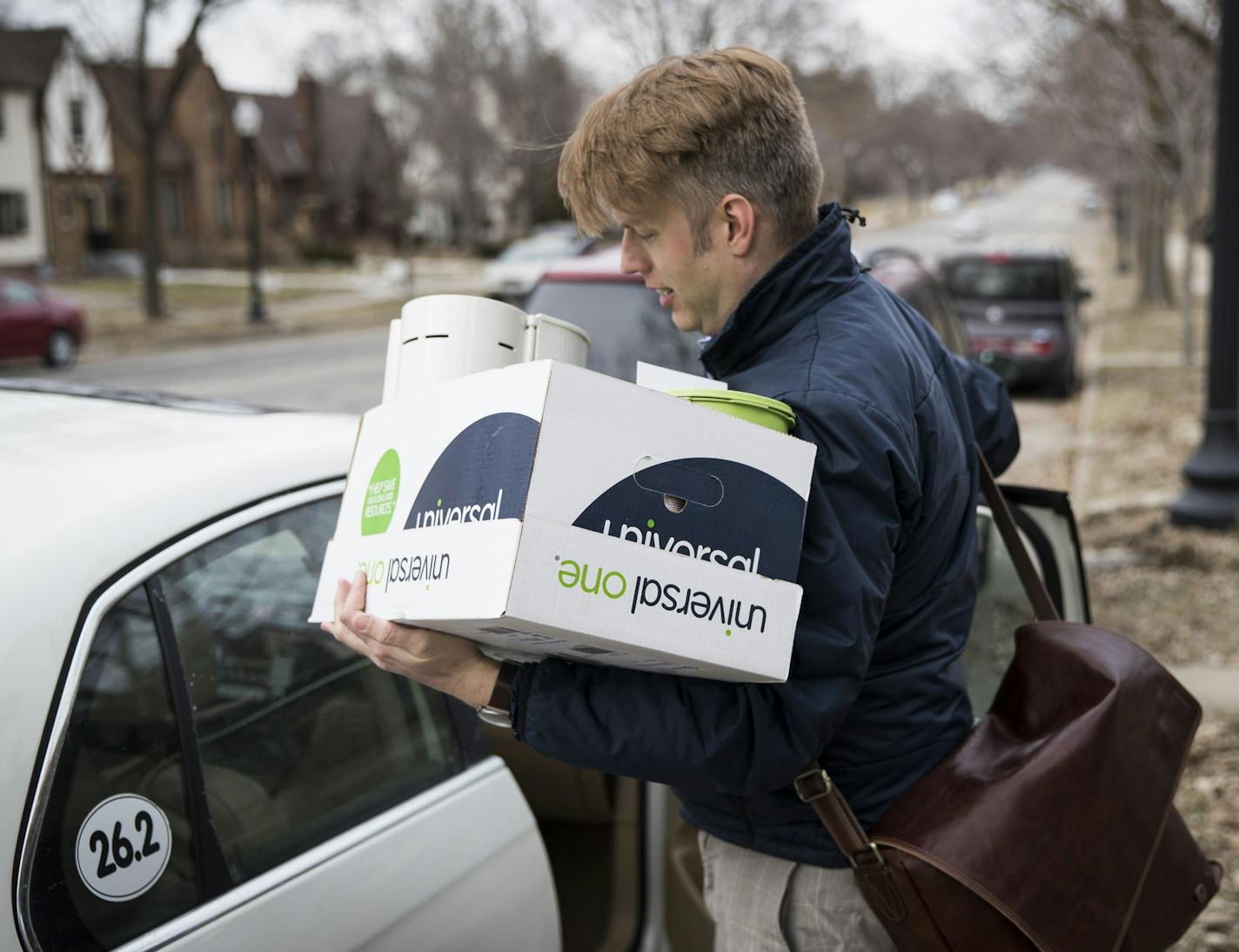 Christian Fritzberg shut his car door after he unloaded a box filled with items from his desk after arriving home from his last day of work on March 3, 2017 in Minneapolis, Minn. Fritzberg was was pushed out of his job after his demanding schedule of caregiving for his mother with Parkinson's disease effected his job schedule. ] RENEE JONES SCHNEIDER &#x2022; renee.jones@startribune.com