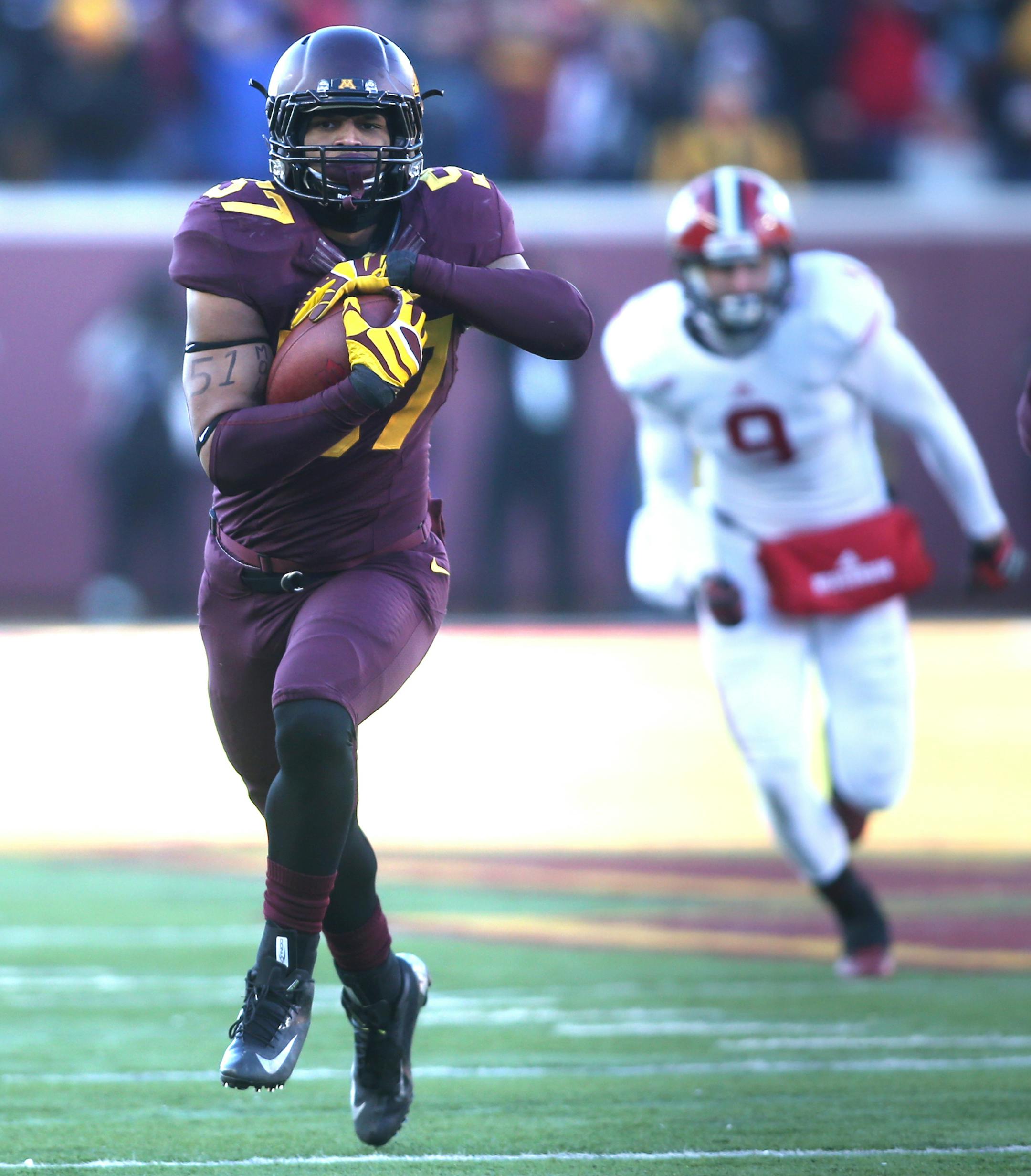 Gophers Aaron Hill ran for the end zone in the first half after an interception. Hill scored on the play.] JIM GEHRZ ‚Ä¢ jgehrz@startribune.com Minneapolis, MN / November 23, 2013, 2:30 PM BACKGROUND INFORMATION- The Minnesota Golden Gopher football team played the Wisconsin Badgers at TCF Bank Stadium.