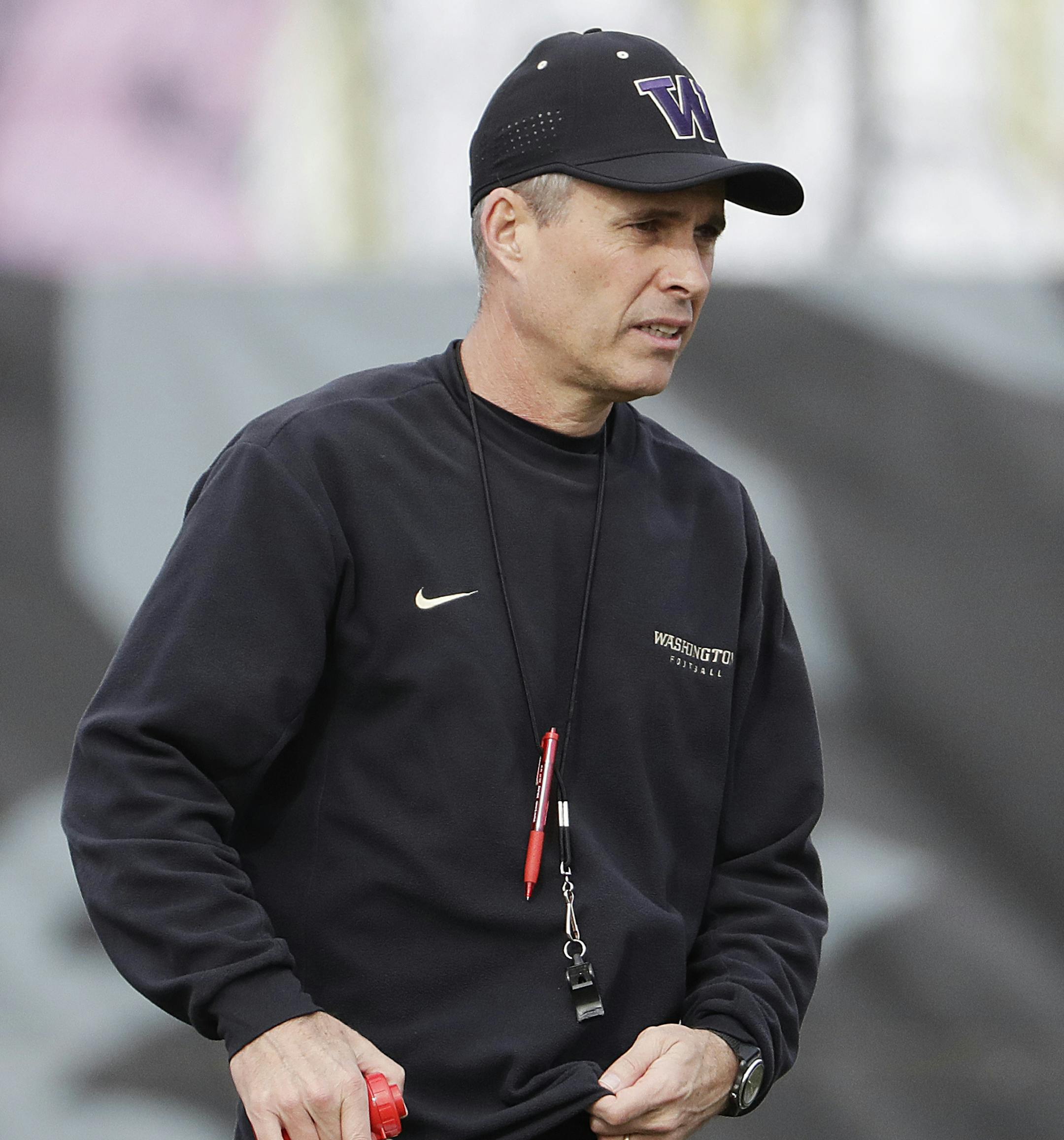 Washington head coach Chris Petersen stands on the field during a Peach Bowl NCAA college football practice in Atlanta, Wednesday, Dec. 28, 2016. Alabama and Washington will face off in the Peach Bowl football game Saturday. (AP Photo/David Goldman) ORG XMIT: GADG103