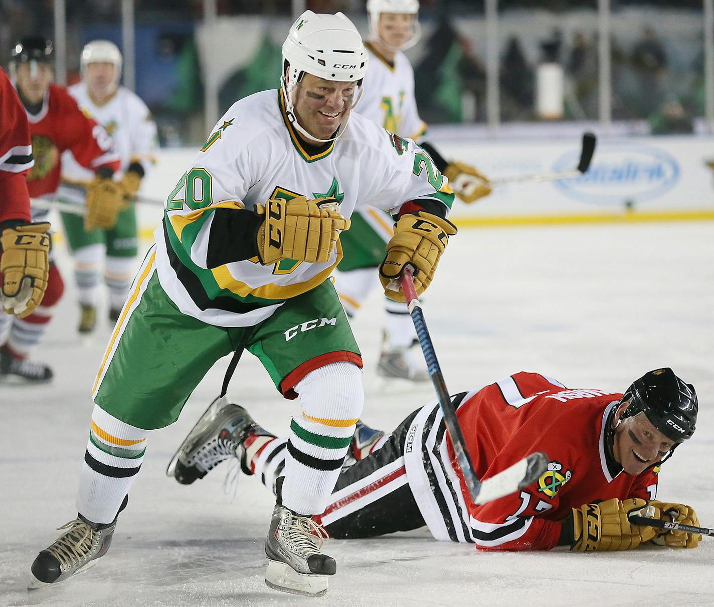 North Stars/Wild Alumni forward Dino Ciccarelli playfully checked Chicago Blackhawks forward Peter Marsh into the ice in the third period of the 2016 Stadium Series Alumni game at TCF Bank Stadium, Saturday, February 20, 2016 in Minneapolis, MN. ] (ELIZABETH FLORES/STAR TRIBUNE) ELIZABETH FLORES &#x2022; eflores@startribune.com