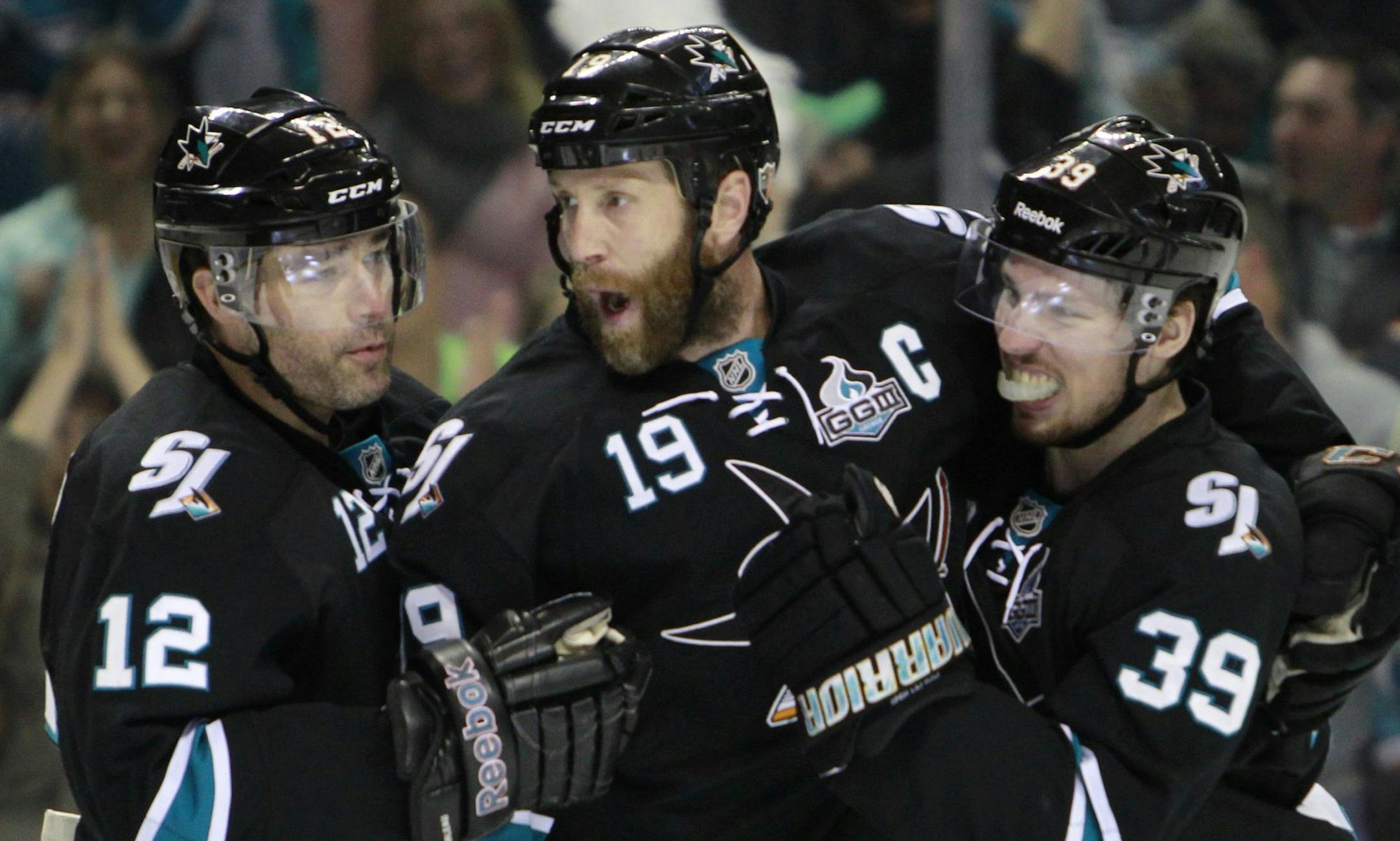 San Jose Sharks' Patrick Marleau (12), Joe Thornton (19) and Logan Couture (39) celebrate the1-0 goal against Los Angeles Kings goaltender Jonathan Quick (32) during the first period in Game 6 of the NHL Western Conference semifinals at HP Pavilion in San Jose, California, on Sunday, May 26, 2013. (Josie Lepe/San Jose Mercury News/MCT)