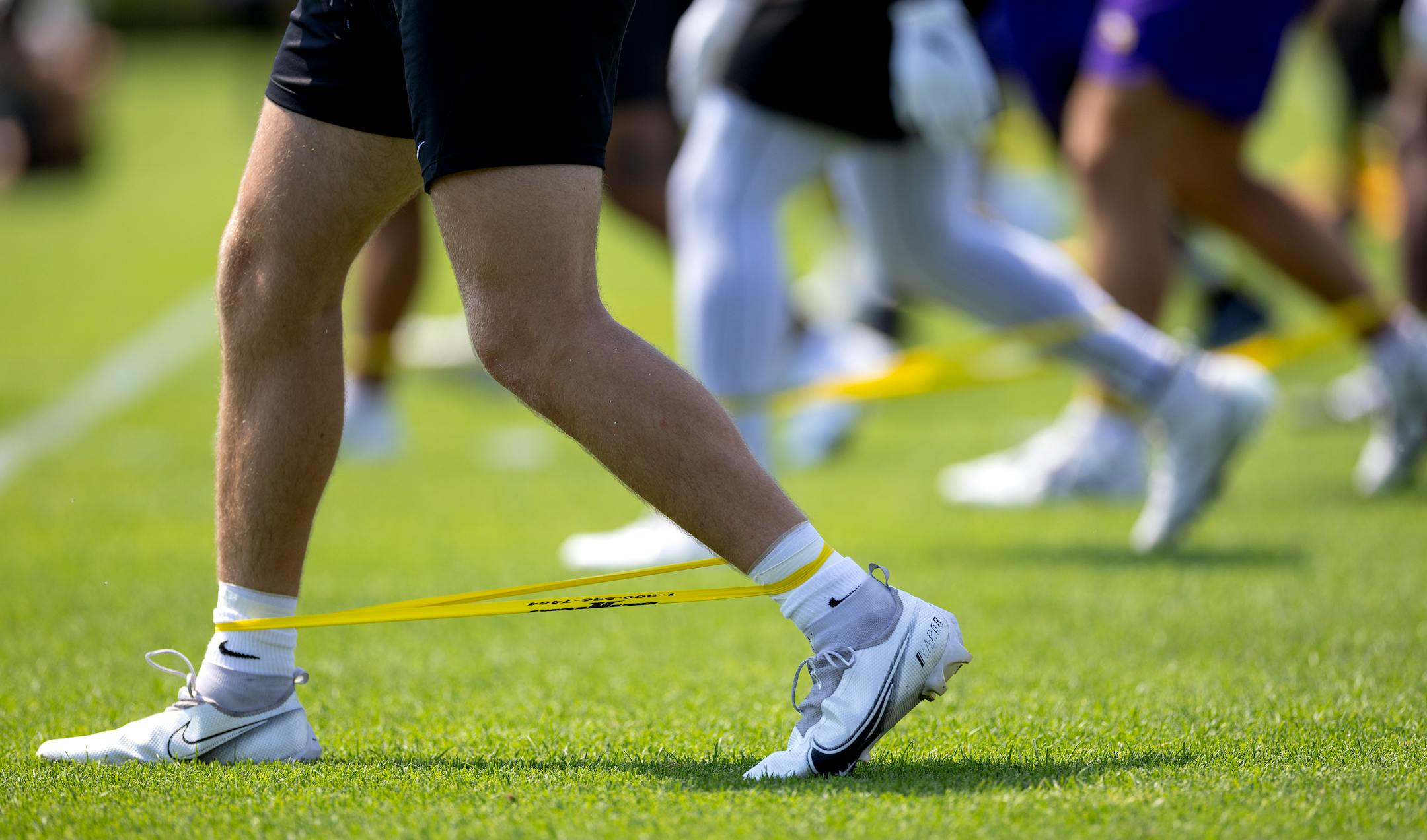 Minnesota Vikings players stretched out.