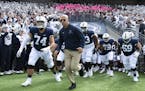FILE - In this Oct. 5, 2019, file photo, Penn State head coach James Franklin leads his team onto the field for their NCAA college football game again