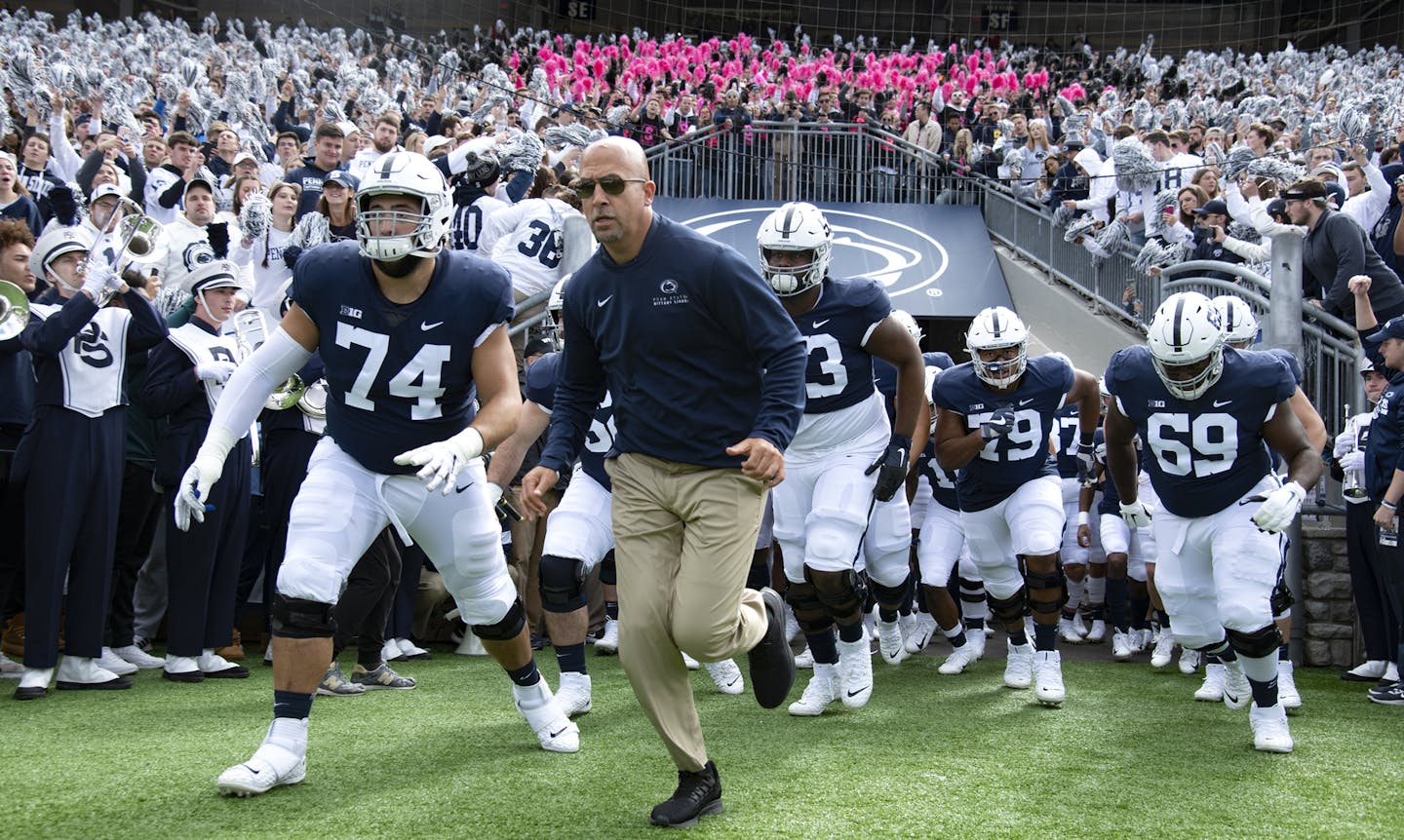 FILE - In this Oct. 5, 2019, file photo, Penn State head coach James Franklin leads his team onto the field for their NCAA college football game against Purdue, in State College, Pa. Penn State (8-0) plays against Minnesota (8-0) on Saturday, Nov. 9. (AP Photo/Barry Reeger, File)