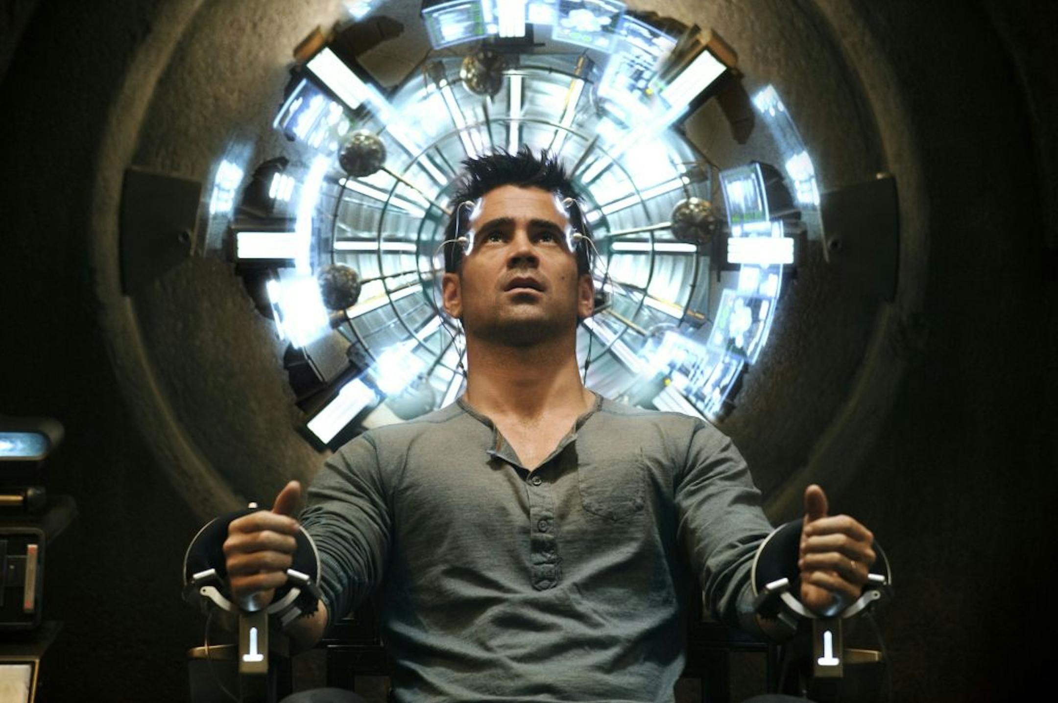 Quaid (Colin Farrell) seated in the Mind Trip Chair inside the Rekall Tripping Den in Columbia Pictures' action thriller TOTAL RECALL.