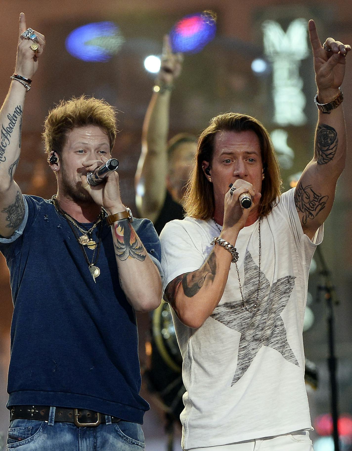 Brian Kelley, left, and Tyler Hubbard of Florida Georgia Line perform on an outdoor stage during the CMT Music Awards on Wednesday, June 10, 2015, in Nashville, Tenn. (Photo by Mark Zaleski/Invision/AP)