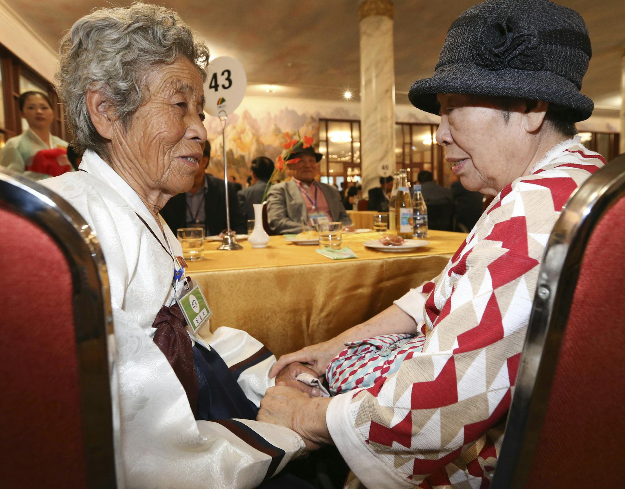 South Korean Lee Eun-lim, 87, right, meets with her North Korean sister Ri Yong Hi, 94, during the Separated Family Reunion Meeting at the Diamond Mountain resort in North Korea, Monday, Aug. 20, 2018. Dozens of elderly South Koreans crossed the heavily fortified border into North Korea on Monday for heart-wrenching meetings with relatives most haven't seen since they were separated by the turmoil of the Korean War. (Korea Pool Photo via AP)