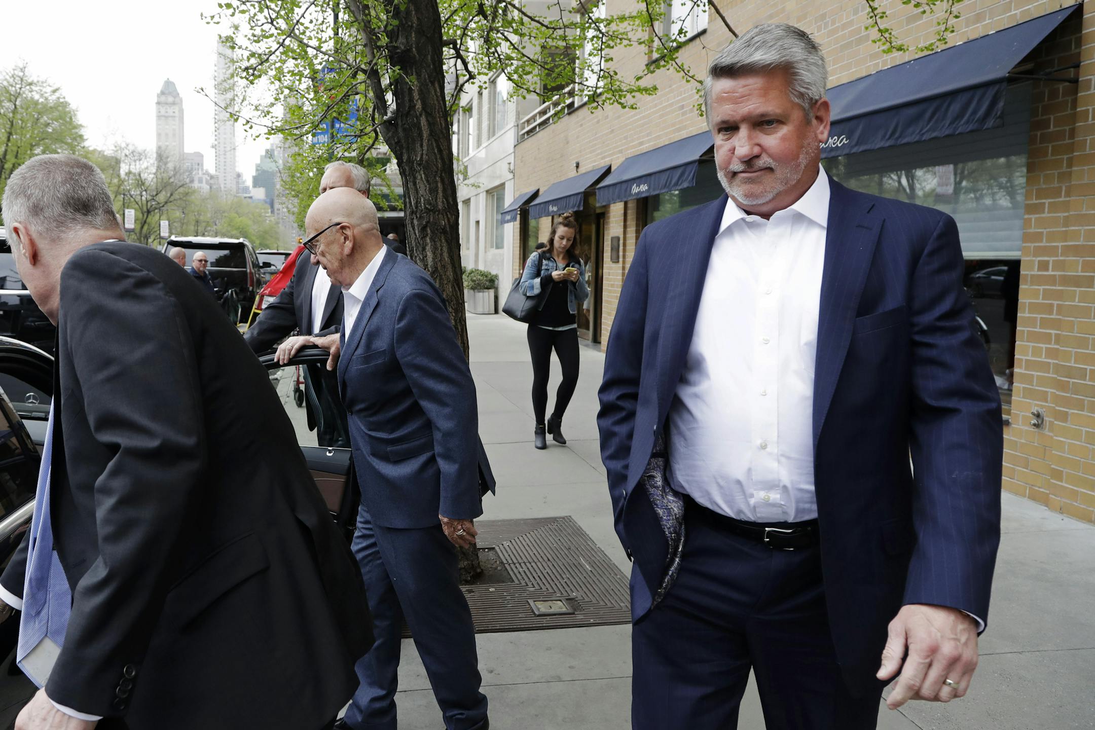 In this April 24, 2017 photo, Fox News co-president Bill Shine, right, leaves a New York restaurant with Rupert Murdoch, second from right, the executive chairman of 21st Century Fox. The turmoil at Fox News Channel has claimed another victim. The network said Monday, May 1, that Shine, a longtime lieutenant of ousted Fox News CEO Roger Ailes, is out. (AP Photo/Mark Lennihan)