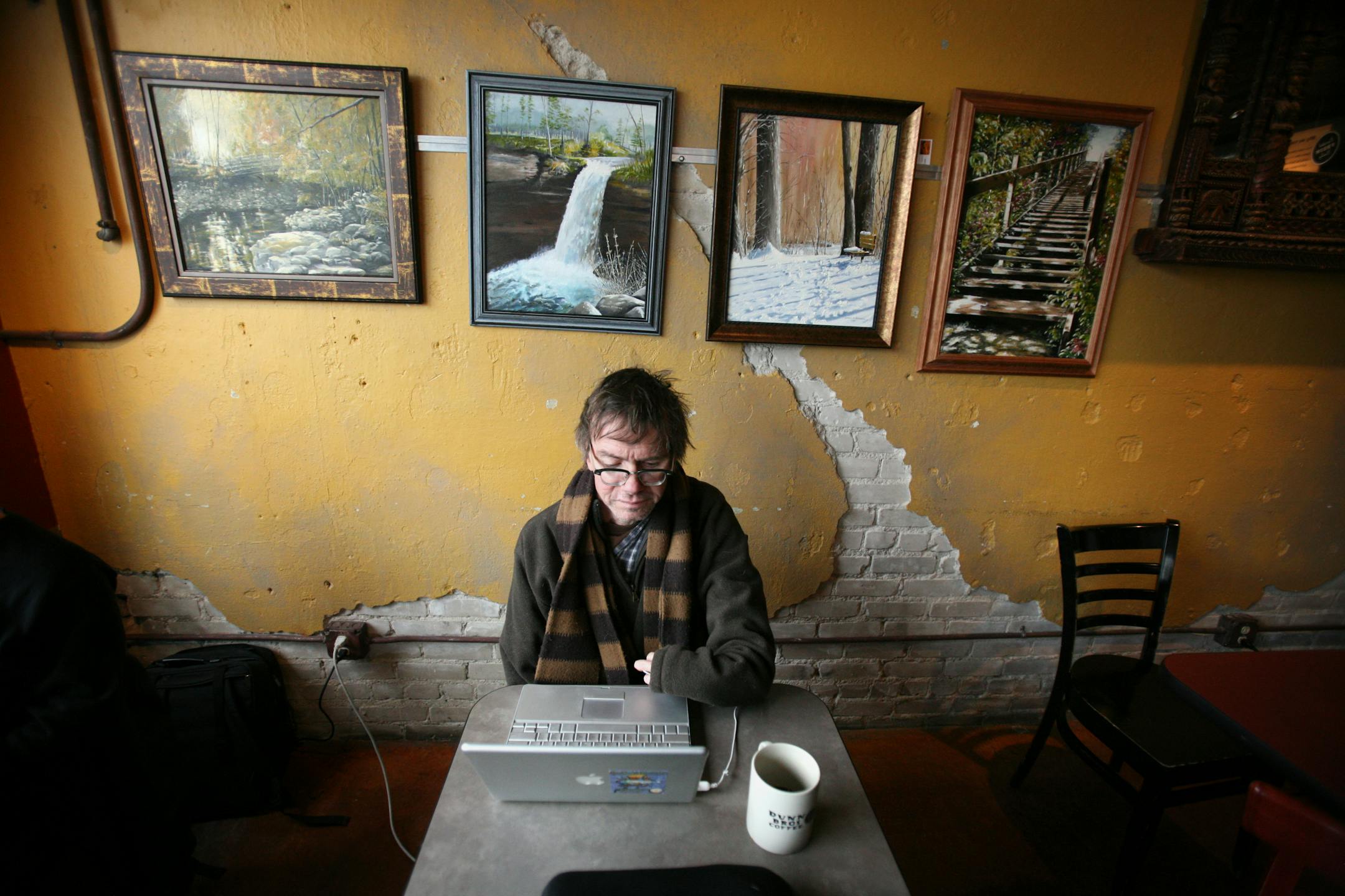 Minnesota author Kevin Kling spent the lunch hour writing on his computer at Dunn Brothers on Lake Street recently. Kling said he wrote most of "The Dog Said How" at the coffee shop.