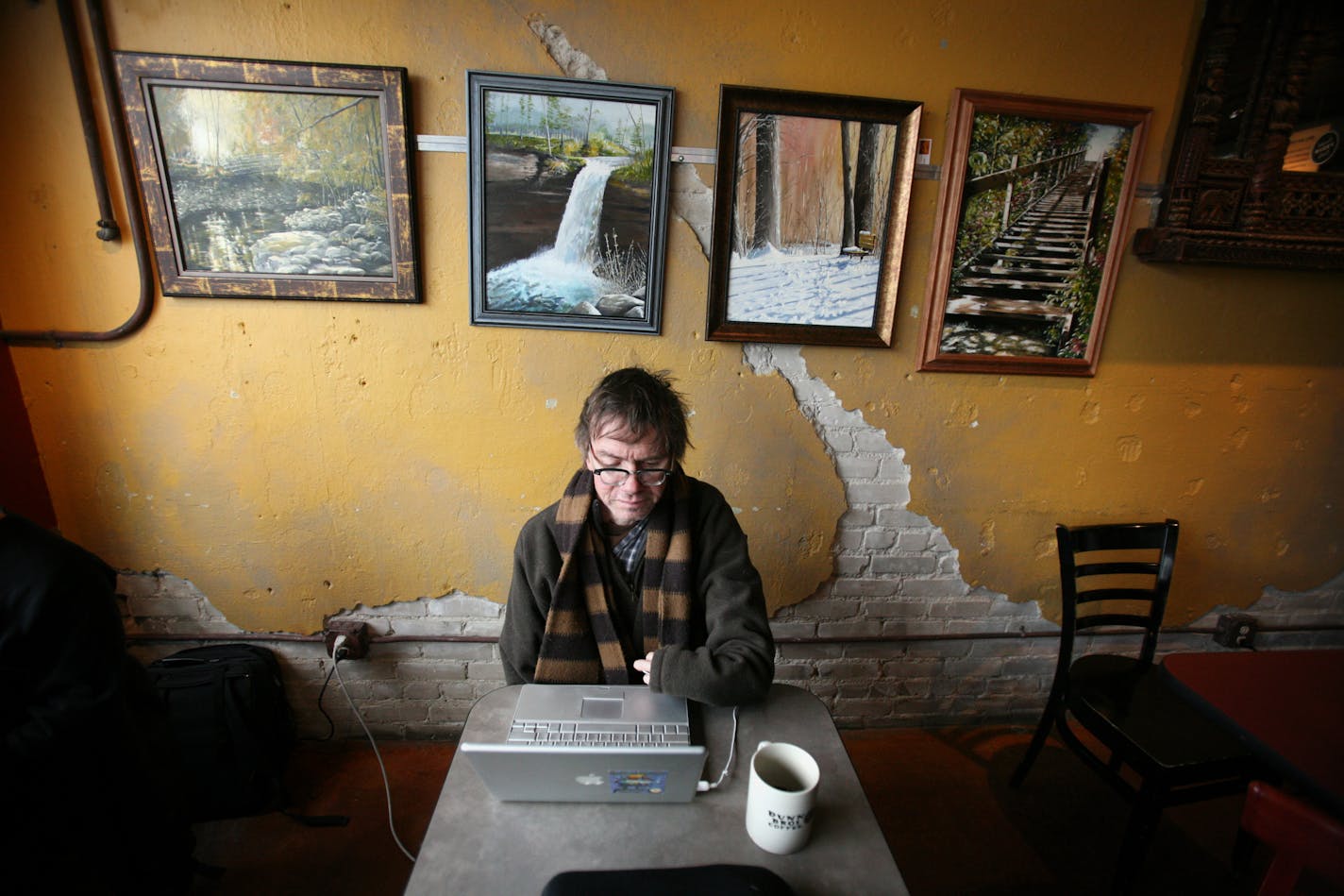 Minnesota author Kevin Kling spent the lunch hour writing on his computer at Dunn Brothers on Lake Street recently. Kling said he wrote most of "The Dog Said How" at the coffee shop.