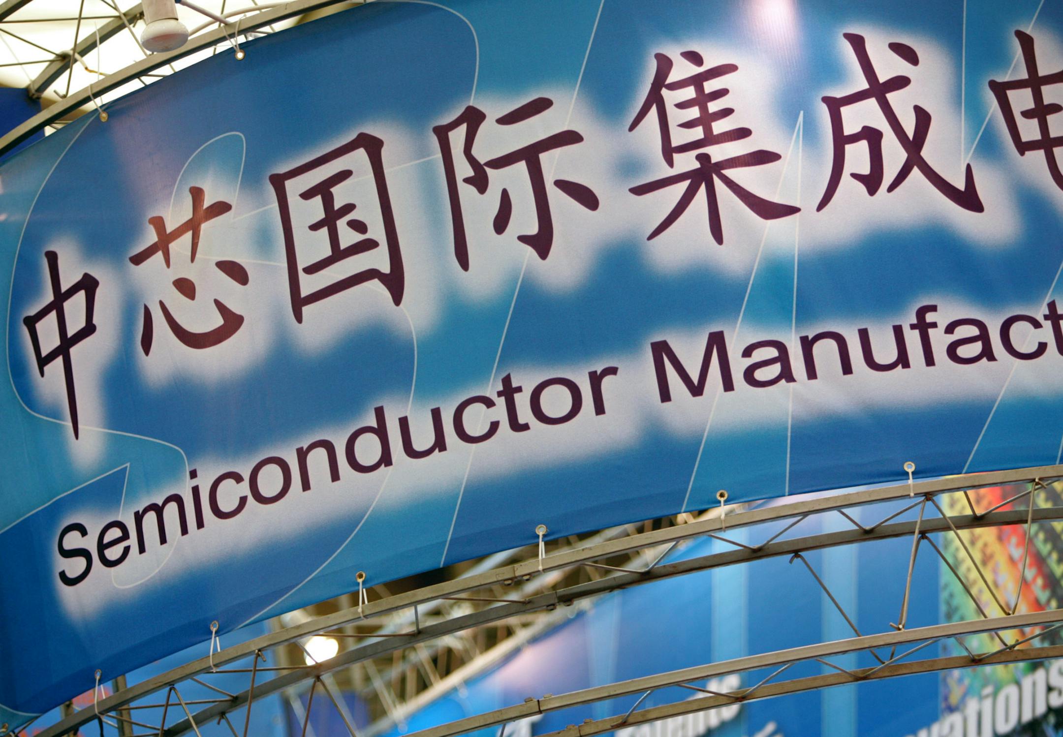 View of a stand of Semiconductor Manufacturing International Corporation (SMIC) during an exhibition in Shanghai, China, March 18, 2010. Shanghai-based Semiconductor Manufacturing International Corporation announced its consolidated results of operations for the three months ended June 30, 2010, and stated its quarter-over-quarter revenue was up by 8.4% to USD381.1 million. The companys second quarter revenue was a jump from USD351.7 million in the first quarter of 2010 and up by 42.5% compared