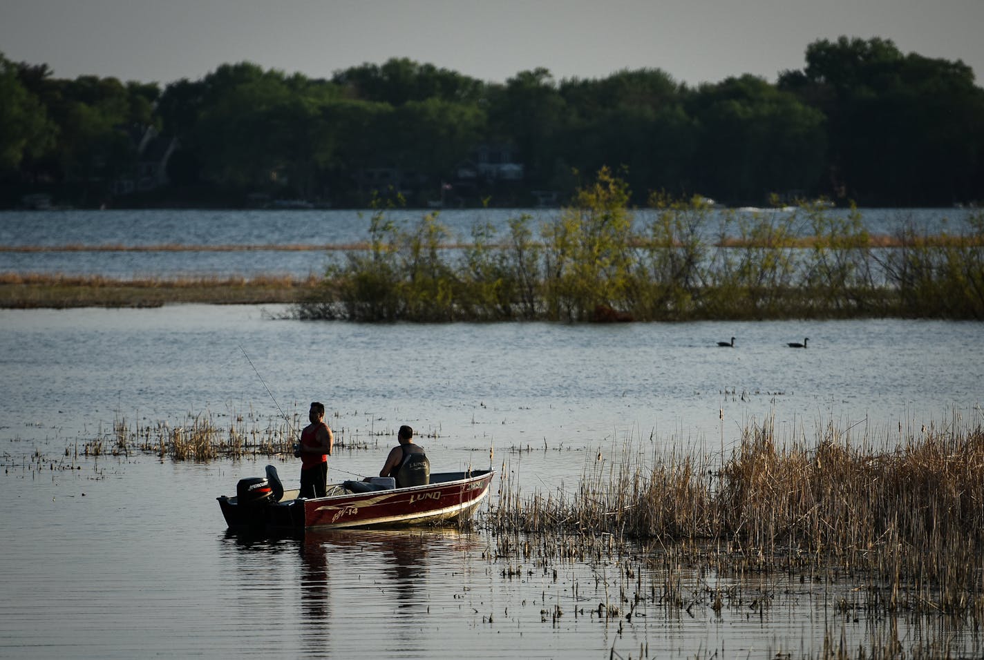 Anglers fished White Bear lake Thursday evening. ] AARON LAVINSKY &#xef; aaron.lavinsky@startribune.com Cities across the east metro are fighting efforts to rein in their groundwater use stemming from a lawsuit over White Bear Lake. About a dozen communities are challenging Department of Natural Resources orders to they impose residential irrigation plans during certain periods and develop plans to switch over to river or lake water. The fight illustrates how difficult it is to corral the region