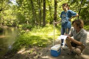 Will Bjorndal, a naturalist intern at he Jay C. Hormel Nature Center in Austin, made notes after he and fellow intern Andie Harveaux took a water samp