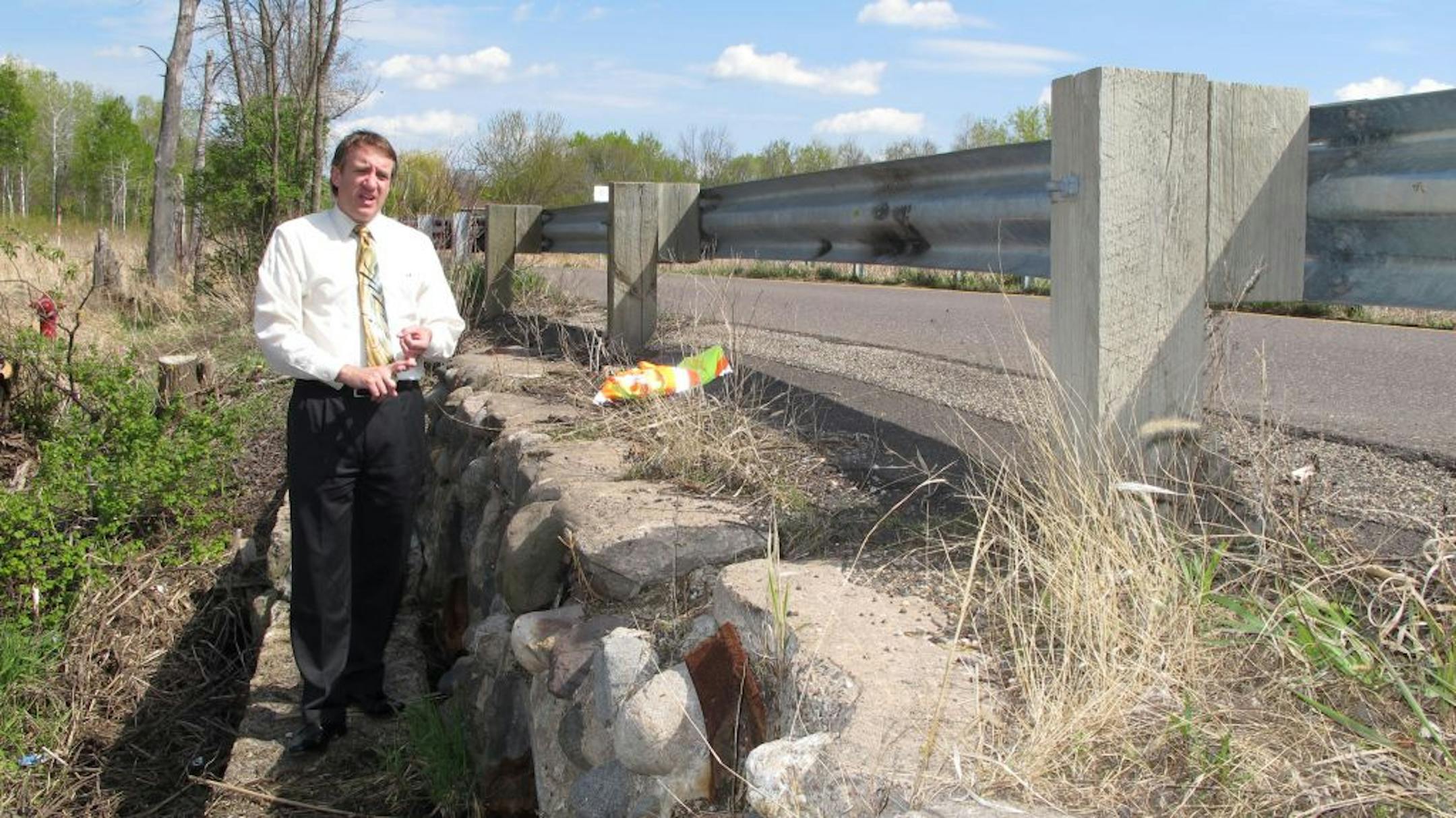 Hugo city engineer Jay Kennedy makes a point about the 129th Street North outlet that serves as a dam and spillway for the 1,000-acre Bald Eagle Lake.
