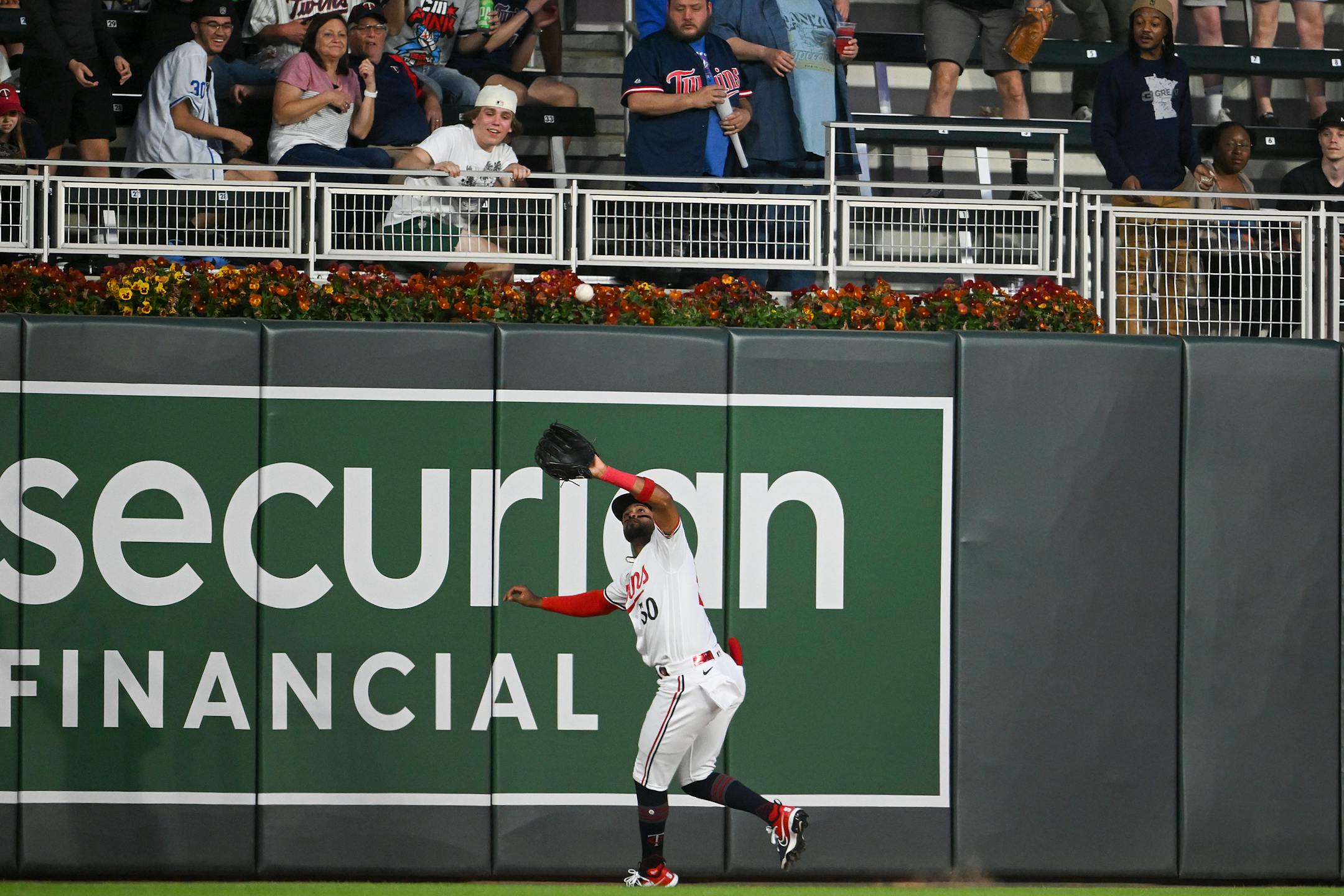 Minnesota Twins left fielder Willi Castro catches a fly ball hit by San Francisco Giants catcher Patrick Bailey to end the top of the eighth inning.