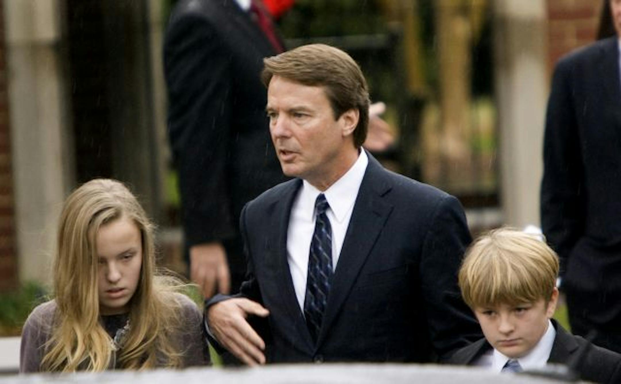 Former U.S. Sen. John Edwards left the Edenton Street United Methodist Church in Raleigh, N.C., with daughter Emma Claire and son Jack after the funeral of his wife, Elizabeth.