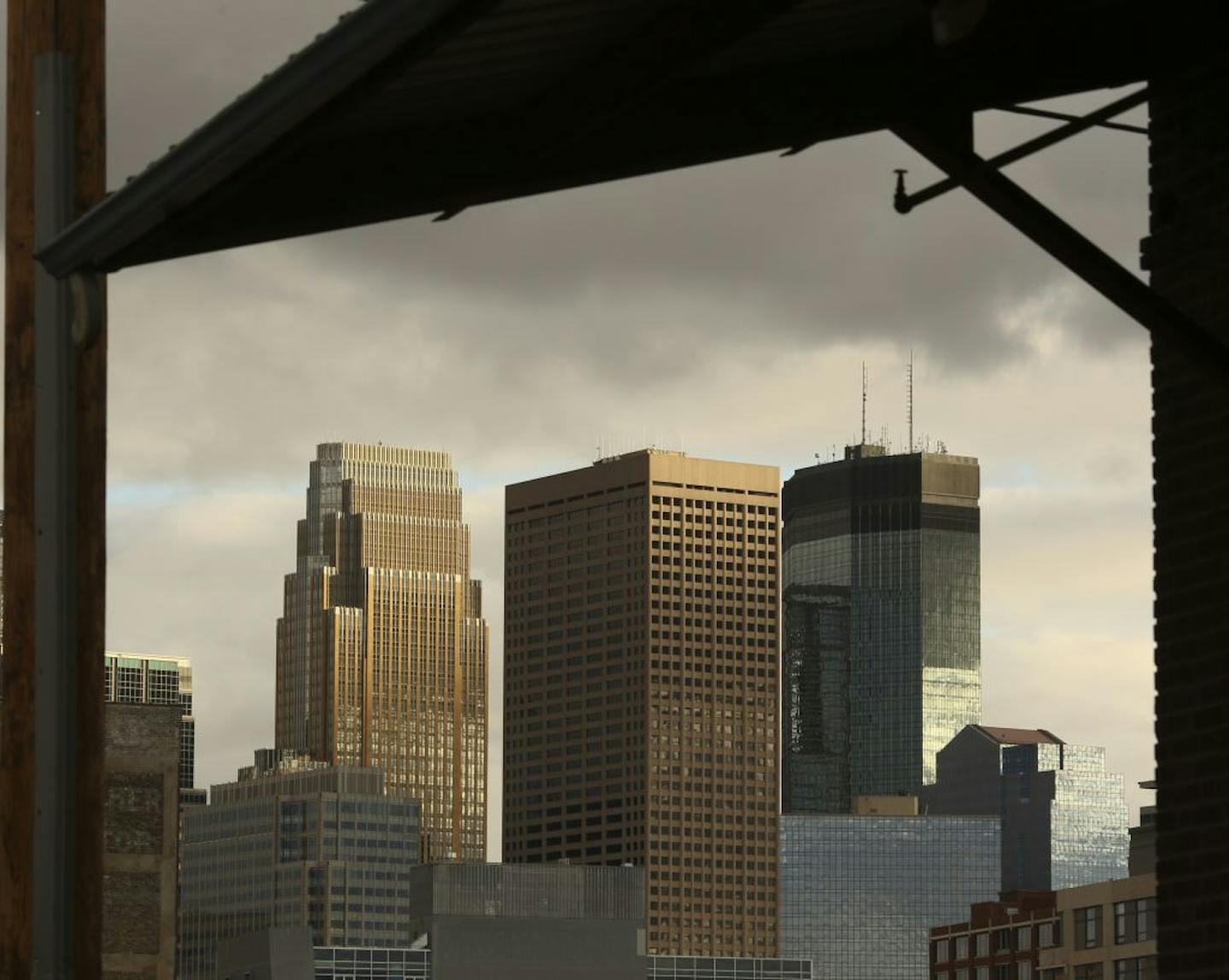 The 50-story 33 South Sixth tower was bracketed Tuesday by two of its downtown Minneapolis neighbors, Wells Fargo Center, left, and the IDS Center.