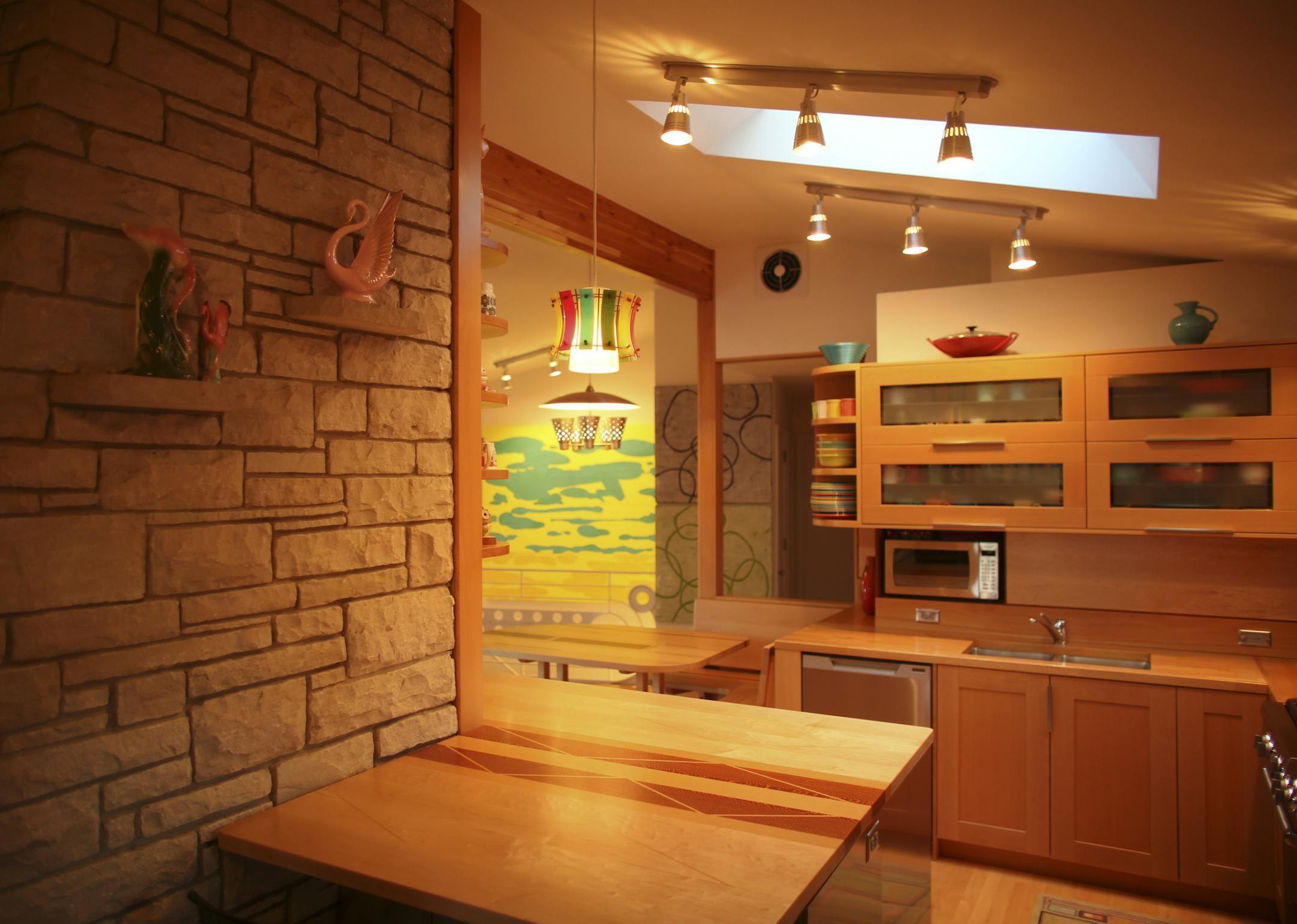 Ed Charbonneau and Erica Berven, with the help of Ed's uncle, architect Daryl Hansen, transformed their 50's era home in St. Louis Park with a remodel of the kitchen, dining area, and living room that showcases their quirky tastes. The kitchen, with its mix of IKEA and custom cabinetry, in the Charbonneau/Berven home Monday evening, September 30, 2013 in Minneapolis. ] JEFF WHEELER ‚Ä¢ jeff.wheeler@startribune.com