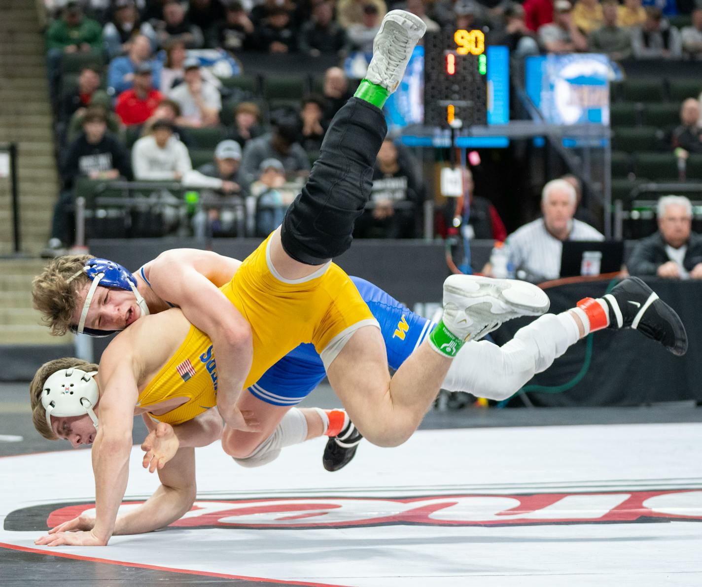 Wayzata wrestler Logan Swensen brings down Prior Lake wrestler Alan Koehler in the Class 3A 126 weight class match during the MSHSL wrestling state tournament championships Saturday, March 4, 2023 at Xcel Energy Arena in St. Paul, Minn. ]