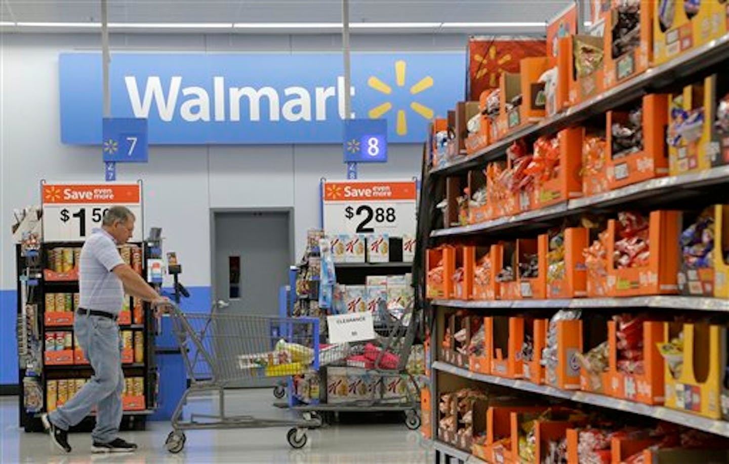 A man shops at a Walmart store in San Jose, Calif., Thursday, Sept. 19, 2013. (AP Photo/Jeff Chiu)