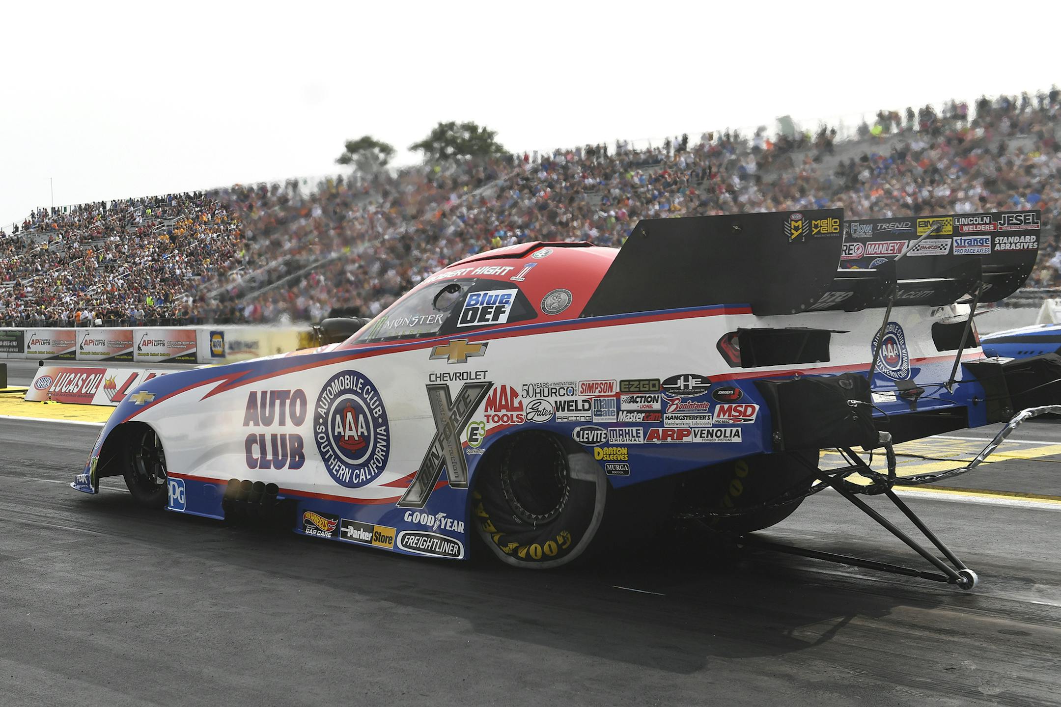 In this photo provided by the NHRA, Robert Hight drives in Funny Car qualifying at the Lucas Oil NHRA Nationals drag races at Brainerd International Raceway on Saturday, Aug. 18, 2018, in Brainerd, Minn. Hight drove to a 3.959-second pass at 324.67 mph to earn the No. 1 qualifying position. (Marc Gewertz/NHRA via AP)