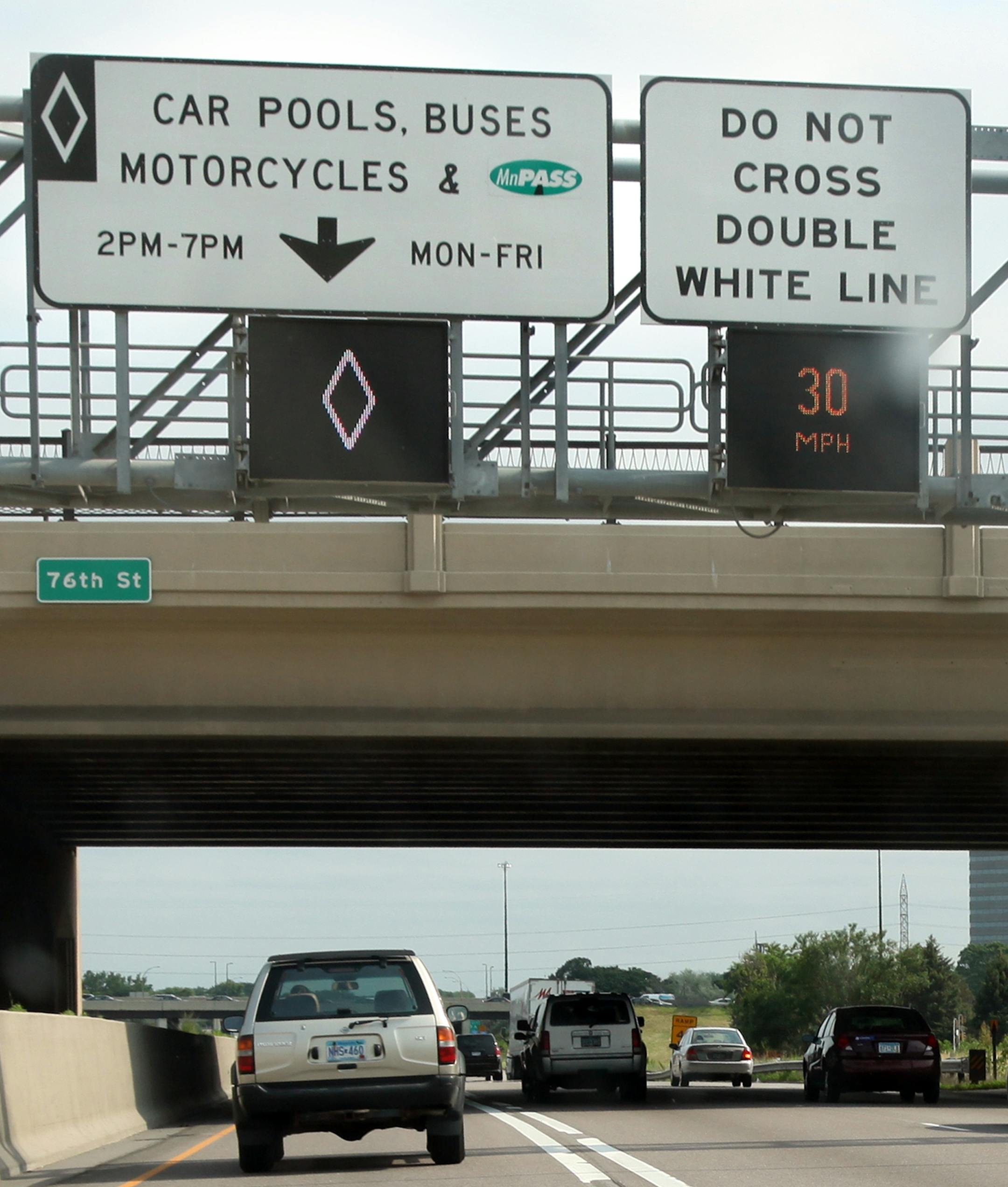 RENEE JONES SCHNEIDER • reneejones@startribune.com Bloomington, Minn. - 6/20/11 - GENERAL INFO - Trooper Kevin Kloss patrolled a section of I-35W southbound during rush hour Monday afternoon to spot illegal drivers in the carpool/MnPASS lane. - IN THIS PHOTO ] An SUV drove in the carpool/MnPASS lane during rush hour Monday afternoon.