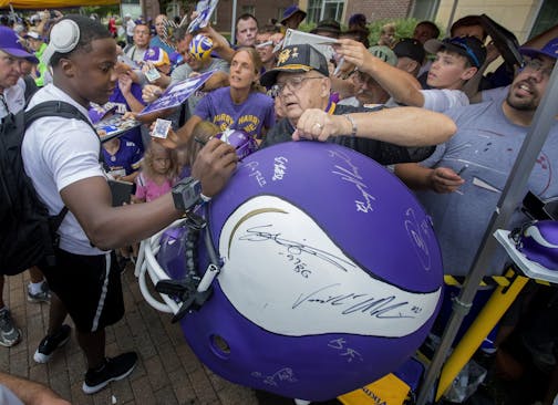 Minnesota Vikings quarterback Teddy Bridgewater signed a large helmet for Milt Toratti, 75, of Cincinnati, Ohio. Veteran players reported for camp on Wednesday. Toratti is form the Iron Range and has attended Vikings camps since 1961.