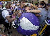 Minnesota Vikings quarterback Teddy Bridgewater signed a large helmet for Milt Toratti, 75, of Cincinnati, Ohio. Veteran players reported for camp on 