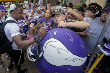 Minnesota Vikings quarterback Teddy Bridgewater signed a large helmet for Milt Toratti, 75, of Cincinnati, Ohio. Veteran players reported for camp on 