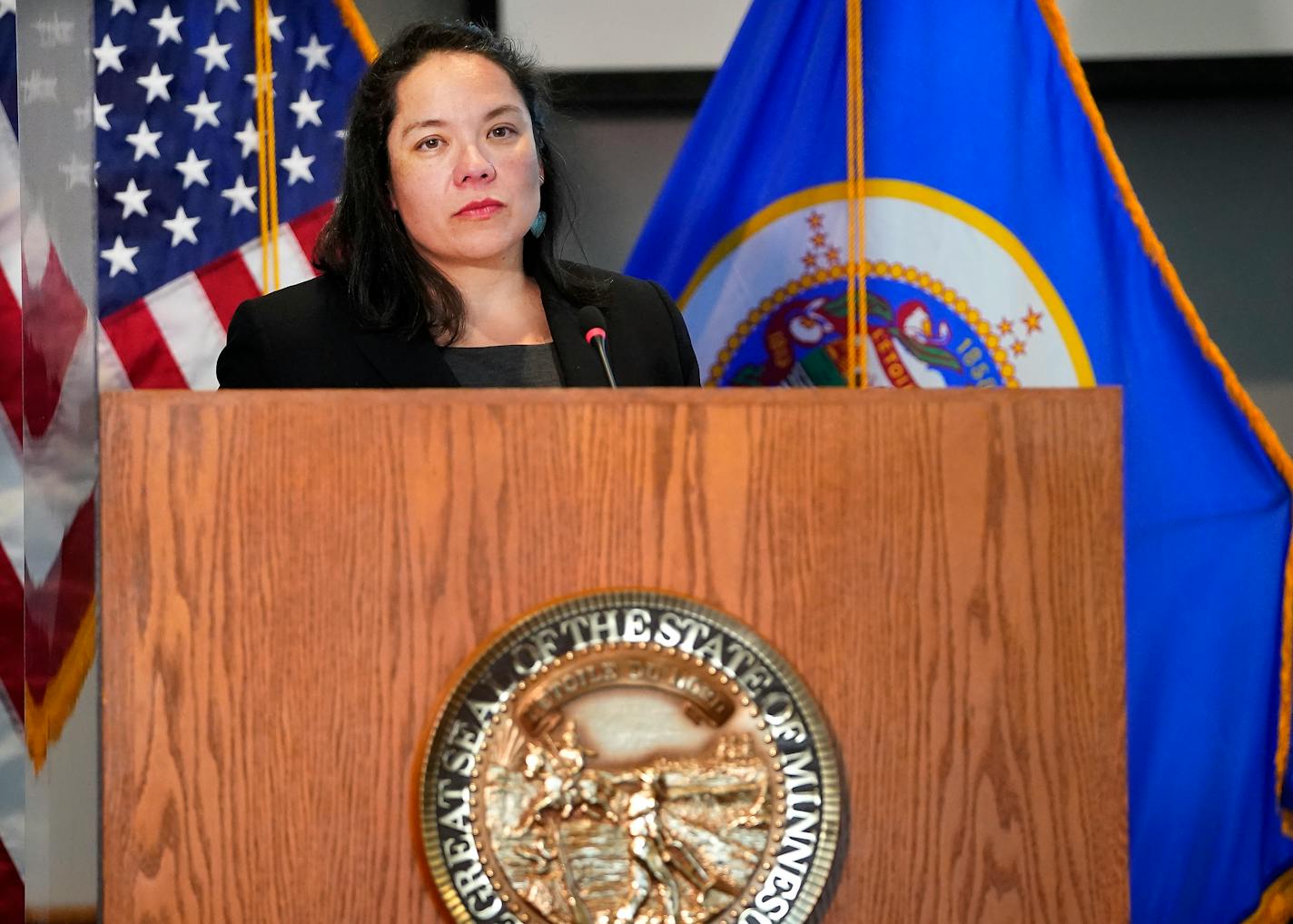 Minnesota Department of Human Rights Commissioner Rebecca Lucero listens during a press conference Wednesday, April 27, 2022 in St. Paul, Minn. A state investigation launched after George Floyd was killed by a Minneapolis police officer has determined that the Minneapolis Police Department has engaged in a pattern of race discrimination. (David Joles/Star Tribune via AP)