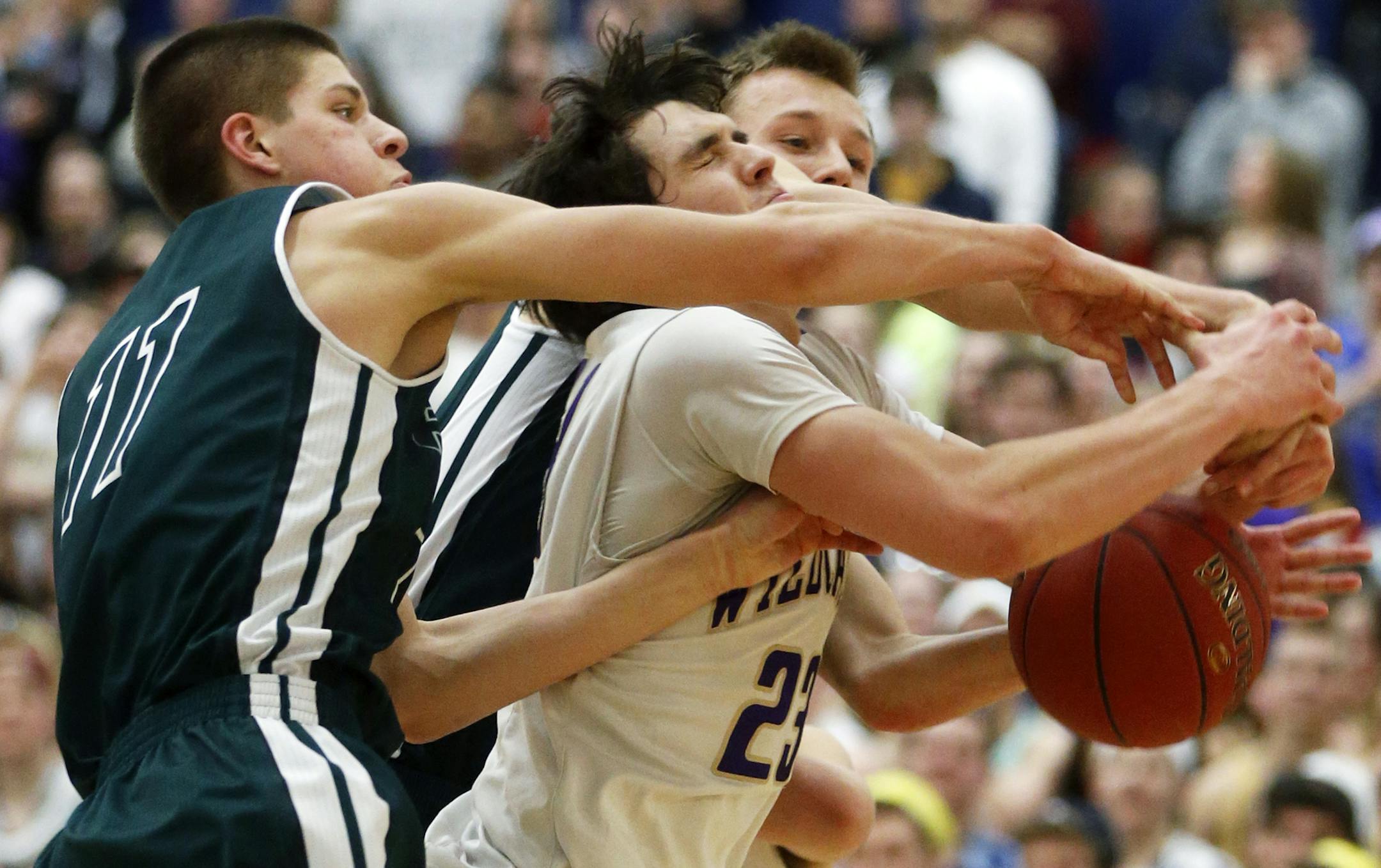 At the Section 6AAA final between Waconia and Holy Family held at Chanhassen H.S., Ryan Boll(23) is defended by H.A. 's Joe Hanel(11).]The final score was a 69-57 victory for H.A.] richard tsong-taatarii/rtsong-taatarii@startribune.com