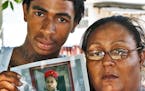 Family of Mark Eric Henderson Jr., 19, of St. Paul, who was fatally shot by police in an incident in Woodbury yesterday. Left, brother Fred Henderson,