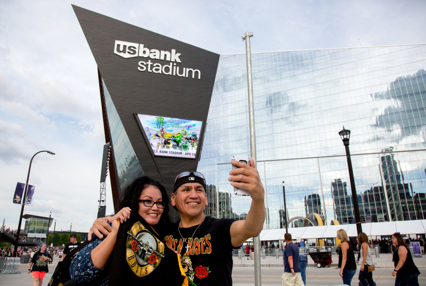 Stephanie and Barlow Wells take a selfie in front of U.S. Bank Stadium after driving six hours to get to the Guns N' Roses concert. ] COURTNEY PEDROZA &#x2022; courtney.pedroza@startribune.com; Guns N' Roses at U.S. Bank Stadium on Sunday July 30, 2017. Outside before concert