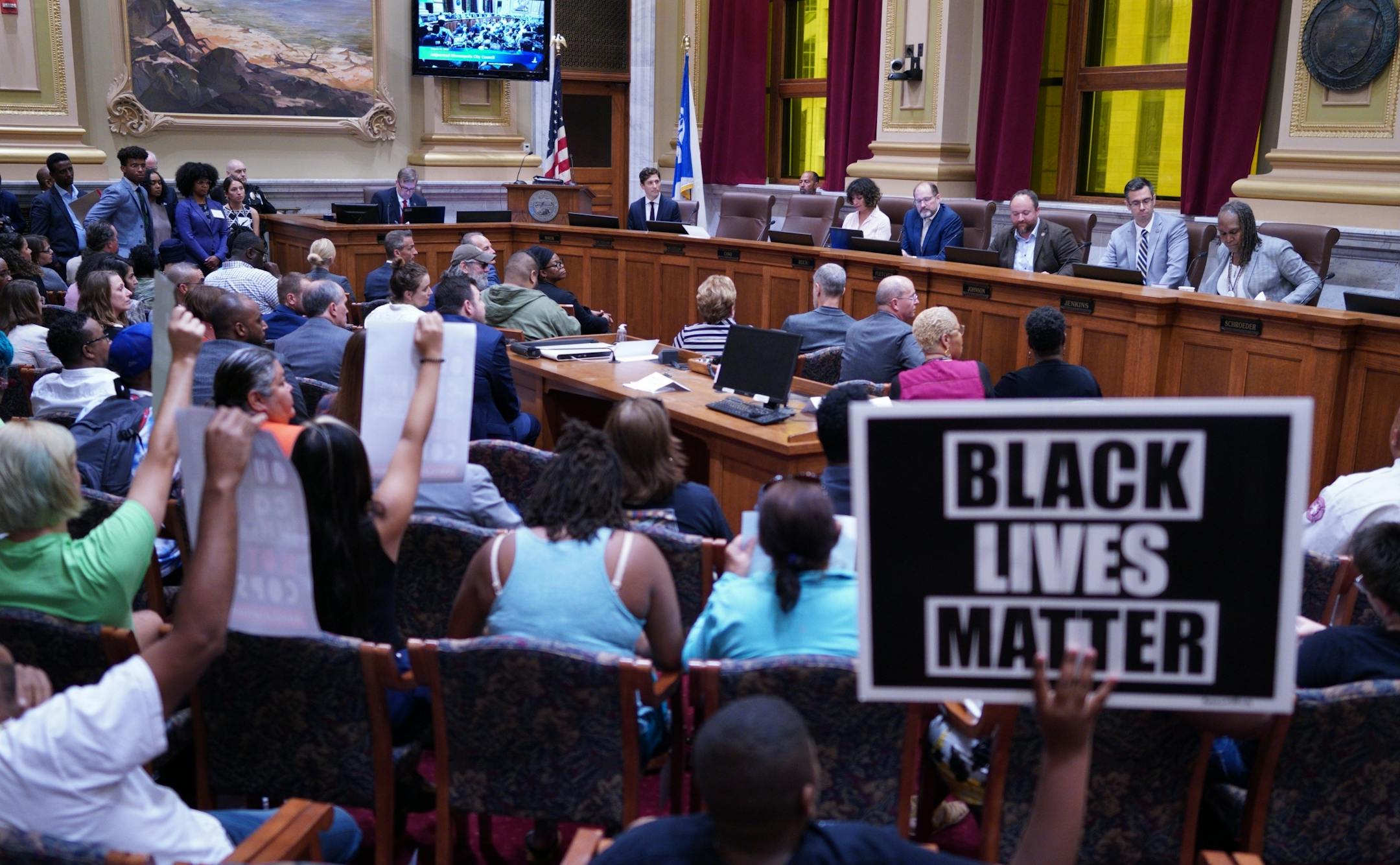 Minneapolis Mayor Jacob Frey proposed adding 14 new police officers during his annual budget address Thursday, far fewer than what the city's police chief requested. Frey's budget address, delivered Thursday over the shouts of protesters to the City Council at City Hall, comes as city leaders are already divided over whether to expand the police force. In July, Chief Medaria Arradondo said the city needed to add 400 patrol officers by 2025 in order to improve response times. But that request has