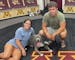 Gophers women's hockey standout Abbey Murphy posed with her older brother Dominic, a St. Cloud State wrestler, and his dog, Messi, in the Gophers lock