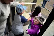 At the Jeremiah Program in St. Paul, Sinying Lee picked up her youngest child Cattleya,3. The older kids Benjamin,4, and Pashalia,5, came along for th