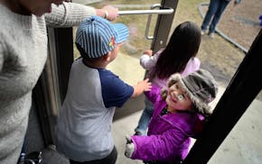 At the Jeremiah Program in St. Paul, Sinying Lee picked up her youngest child Cattleya,3. The older kids Benjamin,4, and Pashalia,5, came along for th