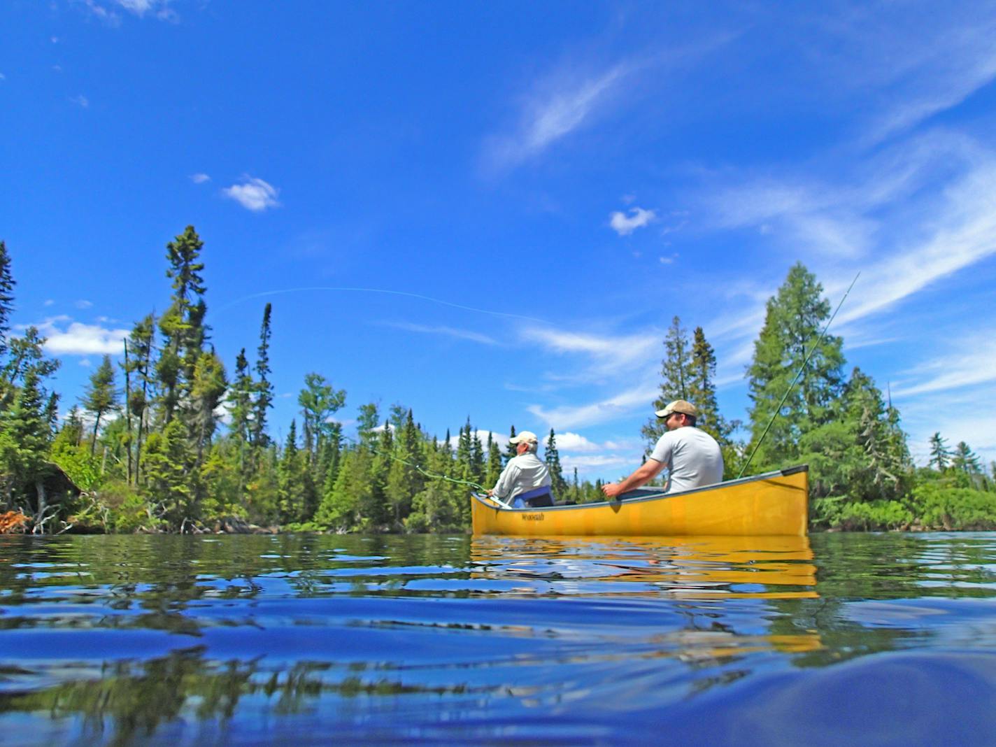 Bob Nasby of St. Paul cast for smallmouth bass, while Joe Friedrichs guided the canoe from its stern. Friedrichs works out of Rockwood Lodge on Poplar Lake on the Gunflint Trail.