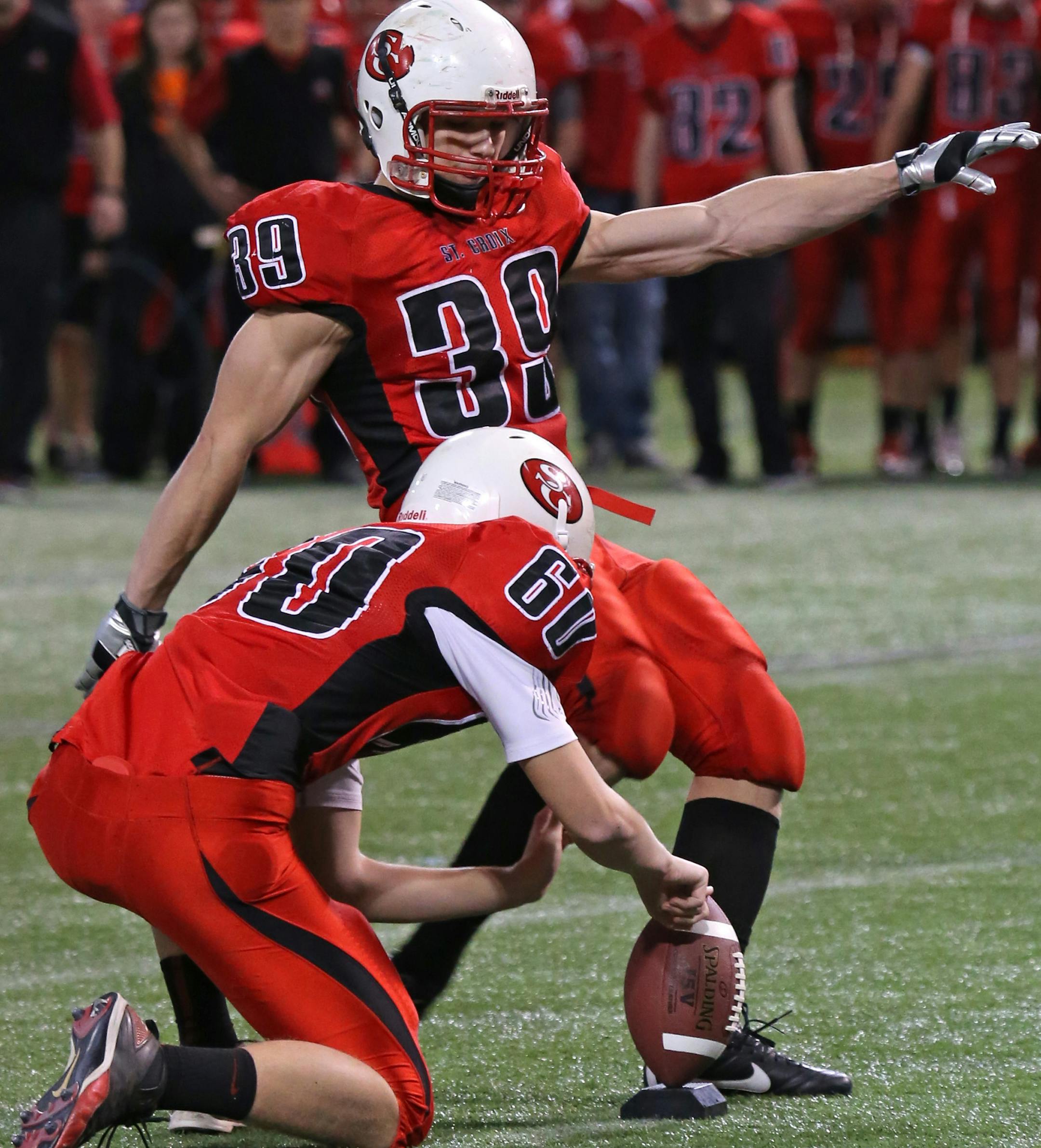 Minnesota State High School Prepbowl, Semifinals, Metrodome, 11/16/13. 1A St. Croix Lutheran vs. Proctor (left to right) St. Croix Lutheran's Daniel Schacht held the ball as Alex Bornschlegl kicked the winning field goal with seconds to go in the game.] Bruce Bisping/Star Tribune bbisping@startribune.com Daniel Schacht, Alex Bornschlegl/roster.
