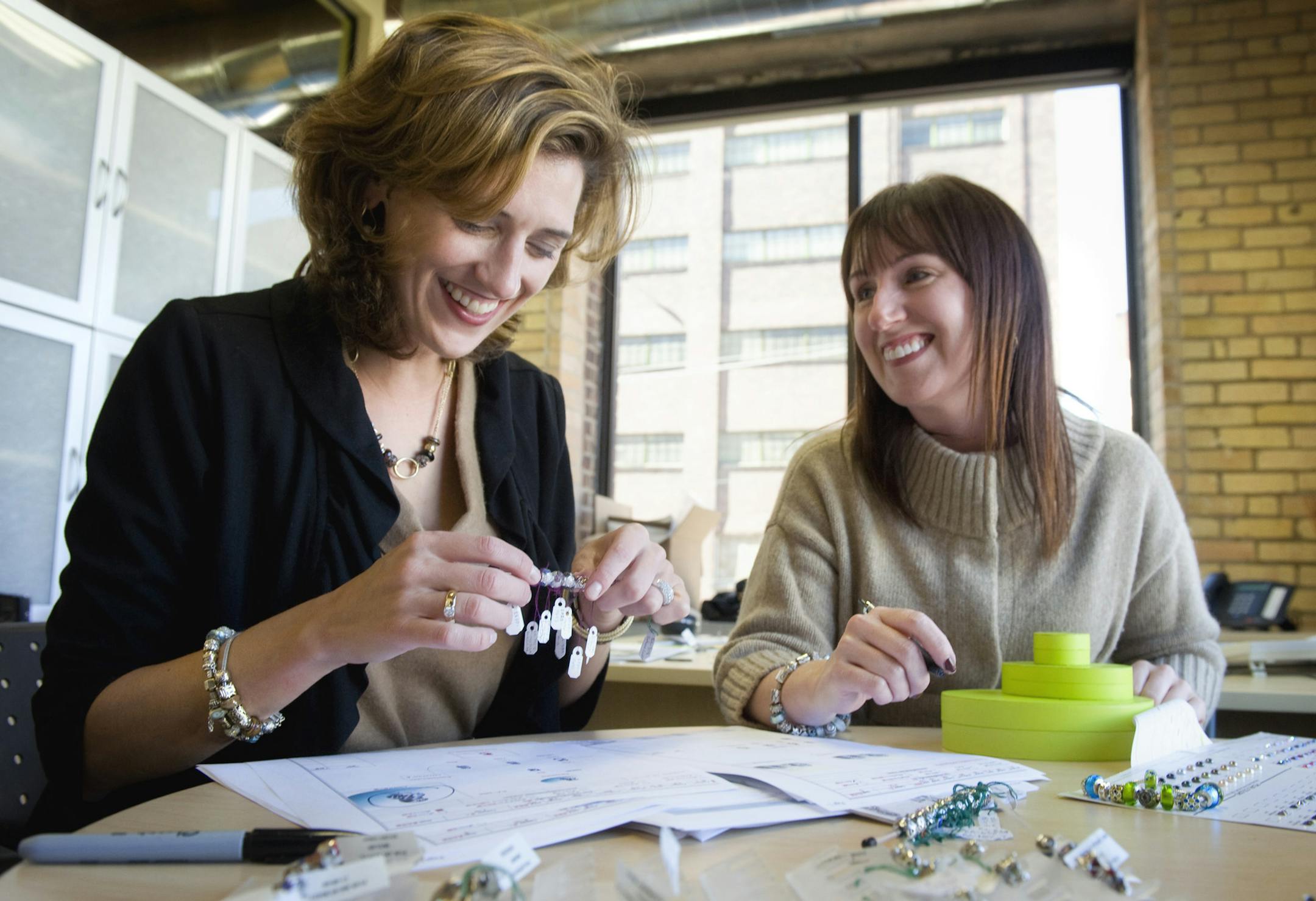 GLEN STUBBE ¬• gstubbe@startribune.com -- Thursday, September 30, 2010 -- Minneapolis, Minn. -- ] Killian Rieder, left, and Debra Graham worked on refining the July 2011 release of Chamilia's line of bracelets and necklaces. Killian is co-founder and Debra is product developer. The company employs 120 people. ORG XMIT: MIN2013081416221814