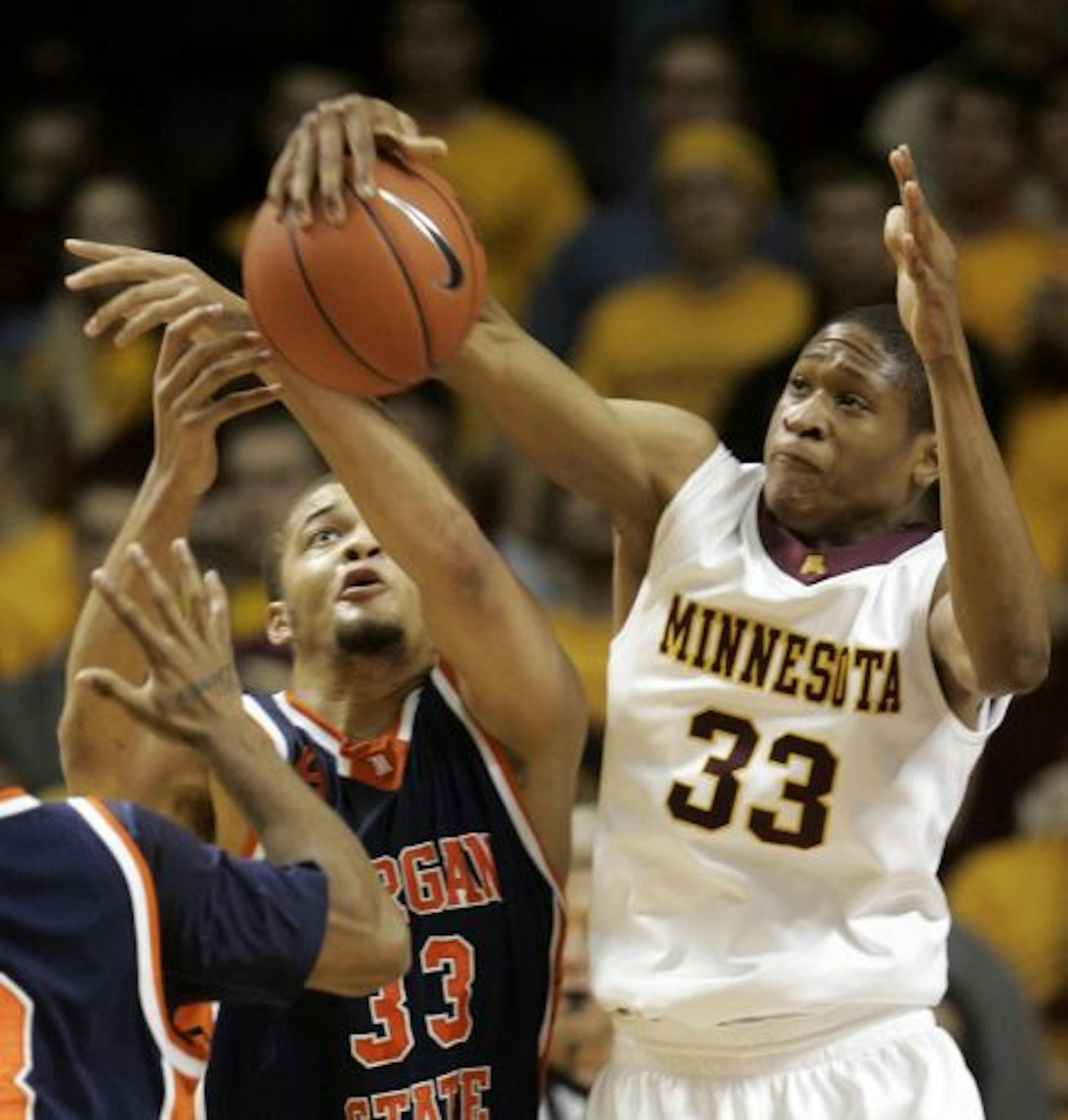 Morgan State versus the Minnesota Gophers in men's basketball at Williams Arena. Minnesota's Rodney Williams (33) outjumps Morgan States Kevin Thompson for a second half rebound during the Gophers 94-64 win.