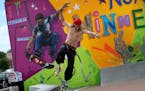 Blake Vang, 21, of Lake Elmo, tried out a quarter-pipe at the new skate-able art park in north Minneapolis, his moves echoed by a mural by New York's 