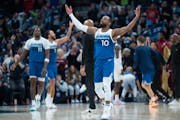 Wolves guard Mike Conley celebrates after the Cavaliers call timeout in the fourth quarter Friday night at Target Center.
