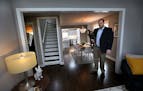Homeowner Tim Jarvis with Pookie, his French bulldog, in the St. Louis Park home that Jarvis recently remodeled to create a modern bachelor pad.