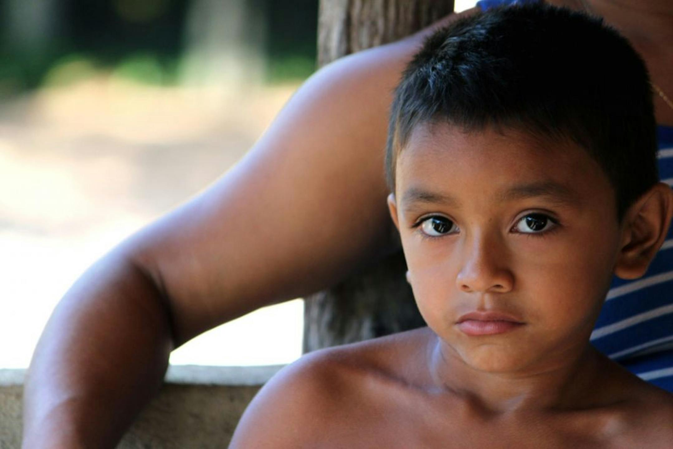 The photographer: Cheri Burg of St. Joseph, Minn. The scene: Burg captured this image of a child with his mother in the Brazilian village of Garimpo during a trip in August for educators organized by the St. Cloud Diocese. This was her favorite among more than 2,000 photos she took on the trip because, "the child seems to have such a wisdom in his eyes," she wrote in an e-mail. The educators learned about the Amazon rainforest and the threat to the tribe's way of life posed by plans for hydroele