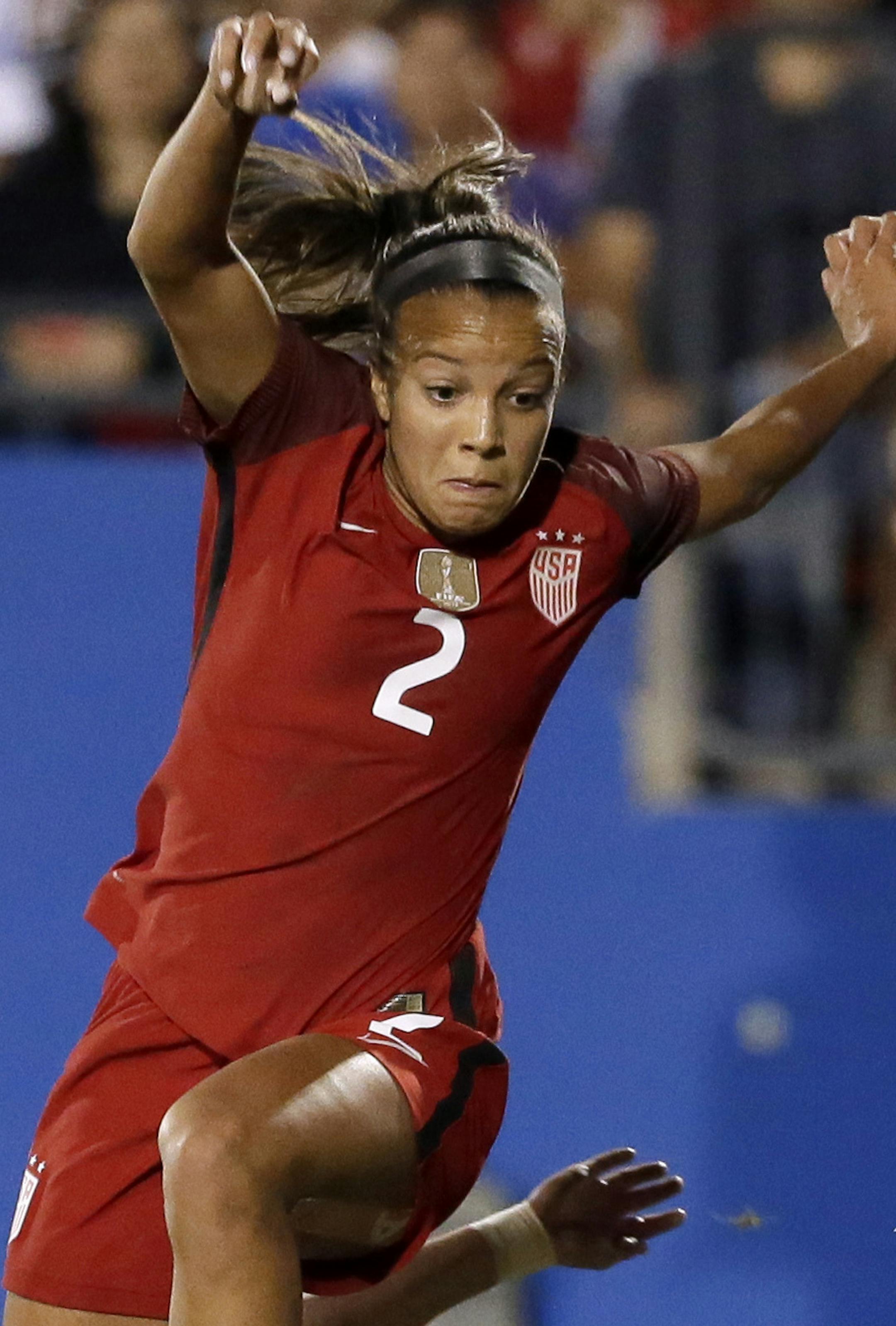 FILE - In this April 6, 2017, file photo, U.S. midfielder Mallory Pugh (2) is tripped by Russia defender Tatiana Sheikina, rear, at the net as Russia goalie Alena Belyaeva (12) defends against the attack in the second half of an international friendly soccer match in Frisco, Texas. Pugh isnít particularly fond of the spotlight. The 19-year-old forward is waaayyy more comfortable on the field. But her on-field ability is what has ultimately led to countless interviews over the past week as s
