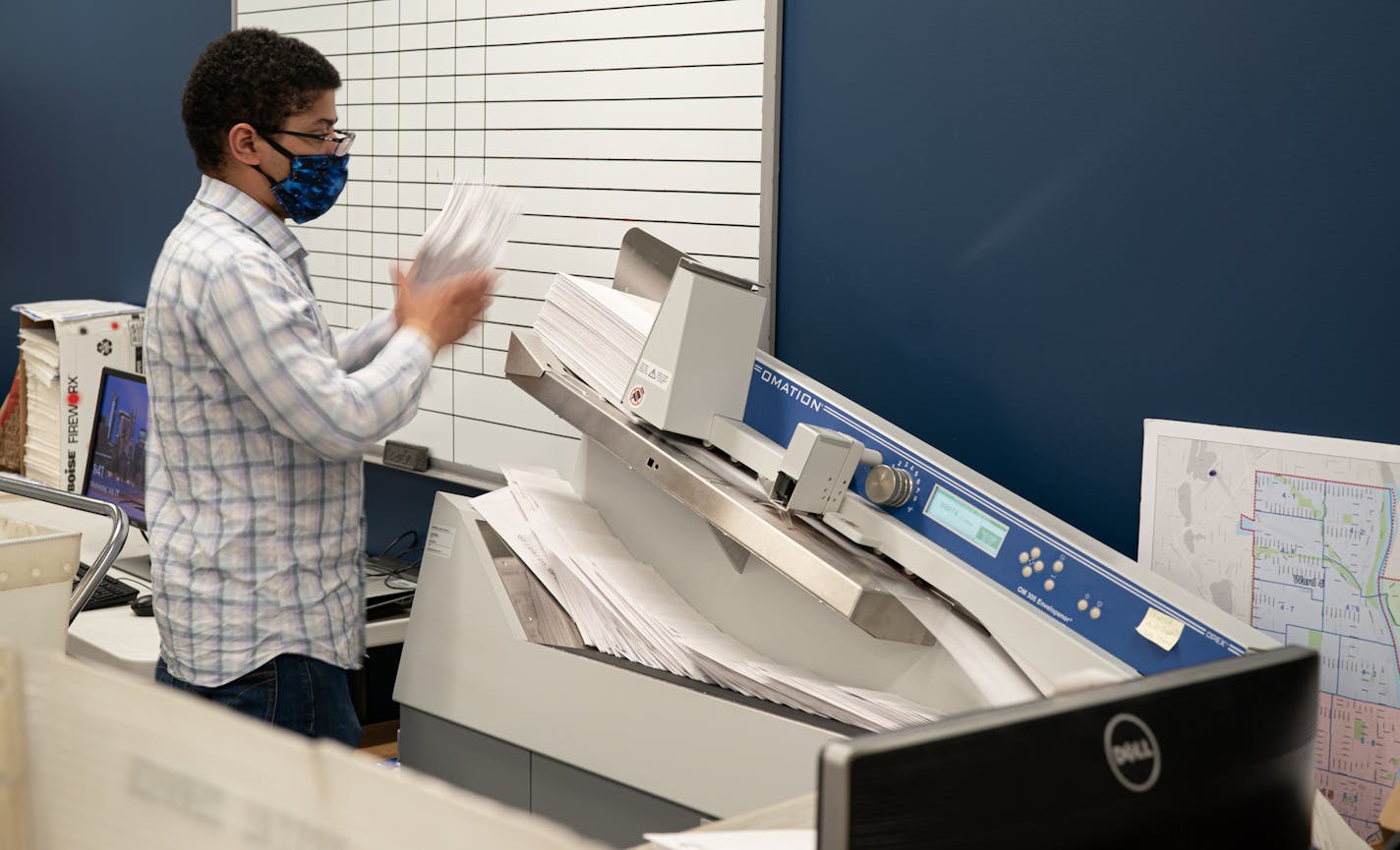 Elections administrator Jon Martin ran newly received ballots through a machine that opens them and stamps the date they were received. Their old machine at Minneapolis Elections & Voter Services could process 400 each hour, this new machine, received in May can process 40,000 in the same amount of time. ] GLEN STUBBE • glen.stubbe@startribune.com Wednesday, July 29, 2020 Absentee ballots are being requested at a record level this year. Nearly 470,000 Minnesotans have requested to vote absentee.