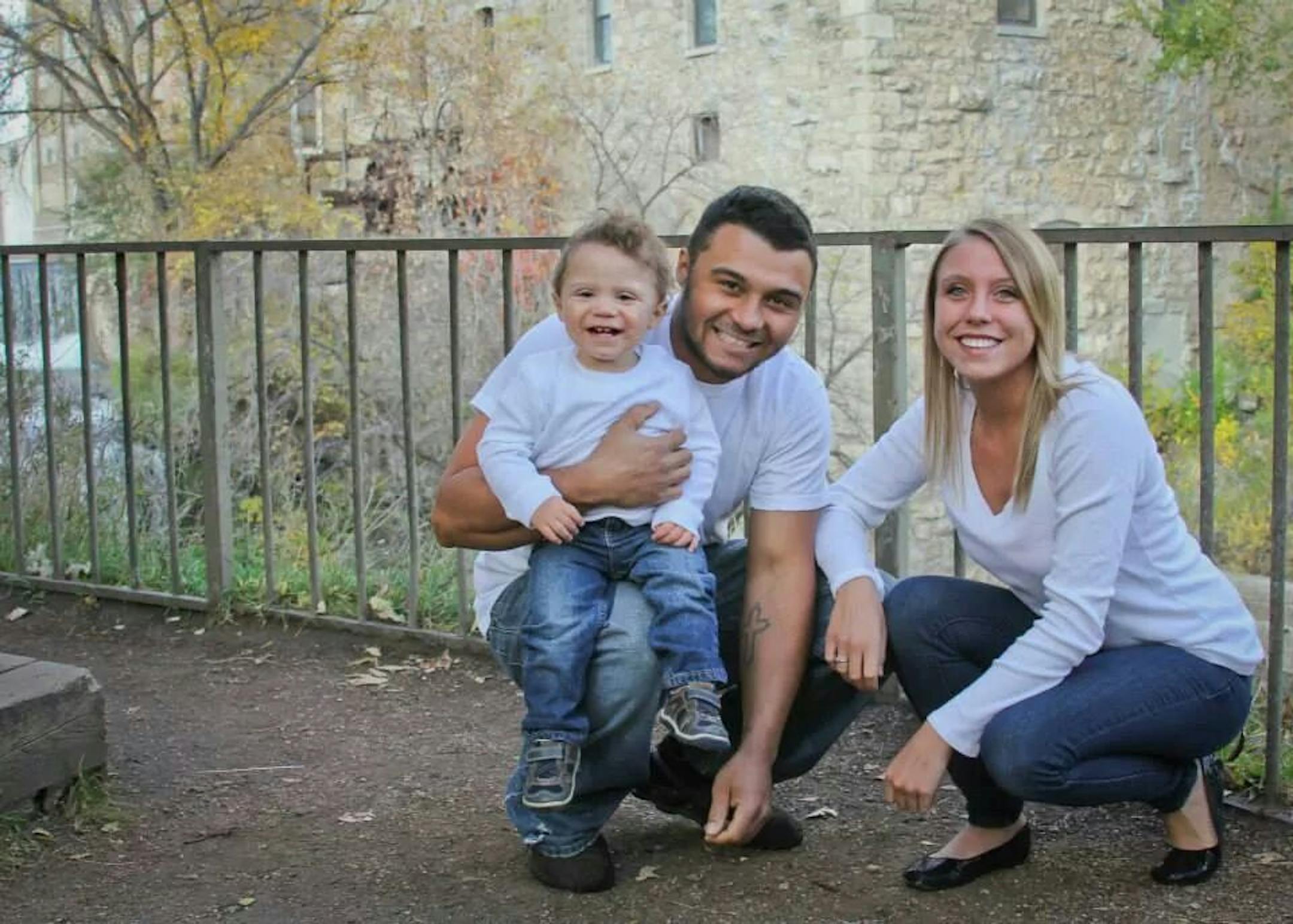 The family of Henry Knoof, a 15-month-old toddler who suffered a traumatic brain injury in a head-on car crash last summer in Eagan caused by a driver who was text messaging, is cautiously optimistic that he will make a full recovery. Henry is pictured with his father, Josh, and his mother, Kelsey.