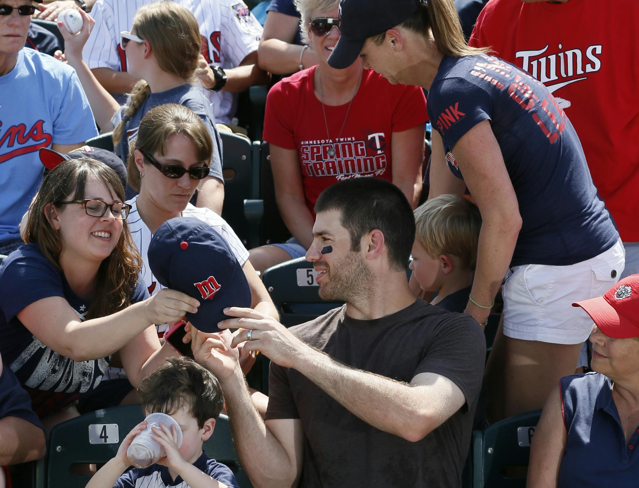 A face in the crowd: Joe Mauer mixed and mingled with the crowd date at the Hammond Stadium in Fort Myers, Fla., this spring.