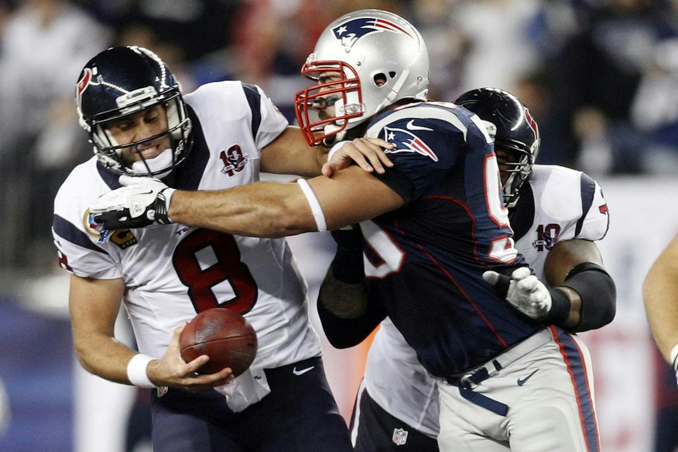 Houston Texans quarterback Matt Schaub is sacked by New England Patriots defensive end Rob Ninkovich.